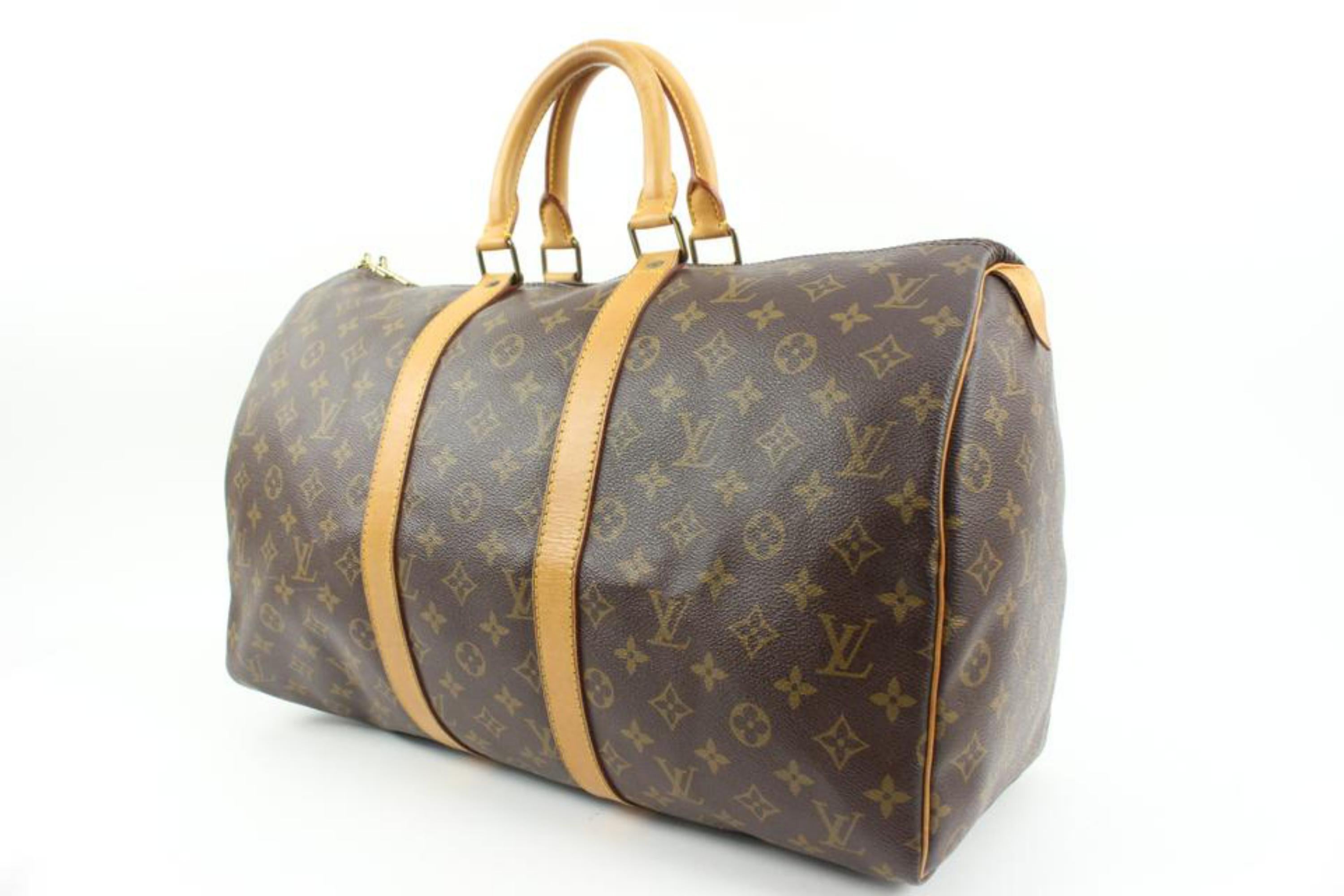 Louis Vuitton Monogram Keepall 45 Duffle Bag 7LV415a
Date Code/Serial Number: SP0971
Made In: France
Measurements: Length:  18