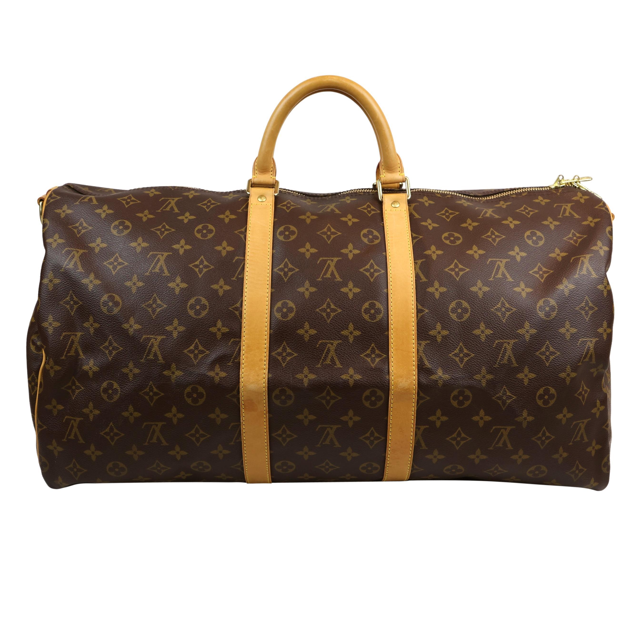 Louis Vuitton Monogram Keepall 55 Bandouliere Duffle Carry-On Bag, France 2000. This iconic keepall was first introduced in the 1930's by Gaston Vuitton as the city 