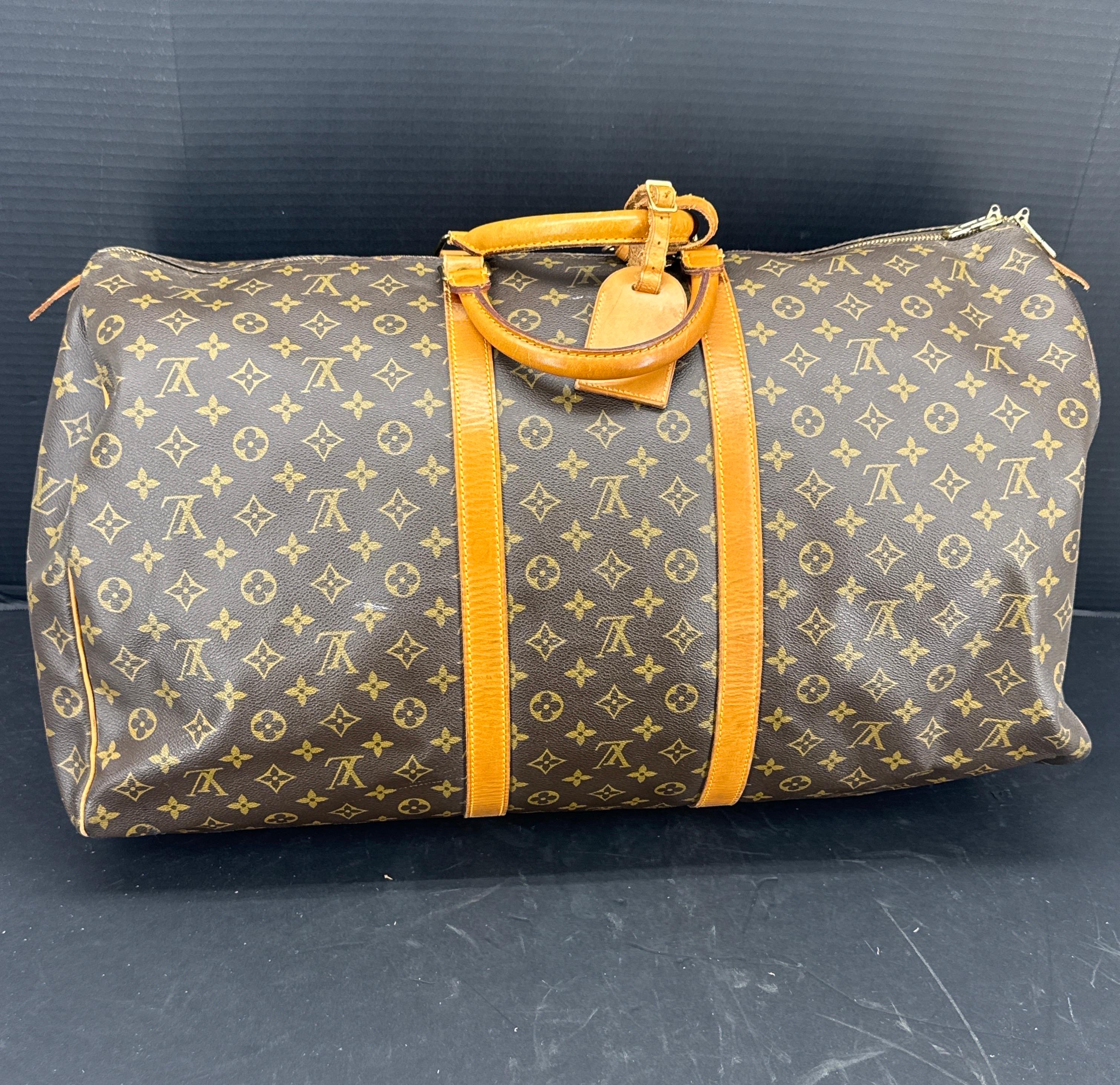 This spacious Monogram canvas features comfortable rounded leather handles and a double zipper. The Vintage Keepall is a classic of the Louis Vuitton travel bag collection. Date Code reads FH1920. The bag was made in France 1990. We feel this bag is