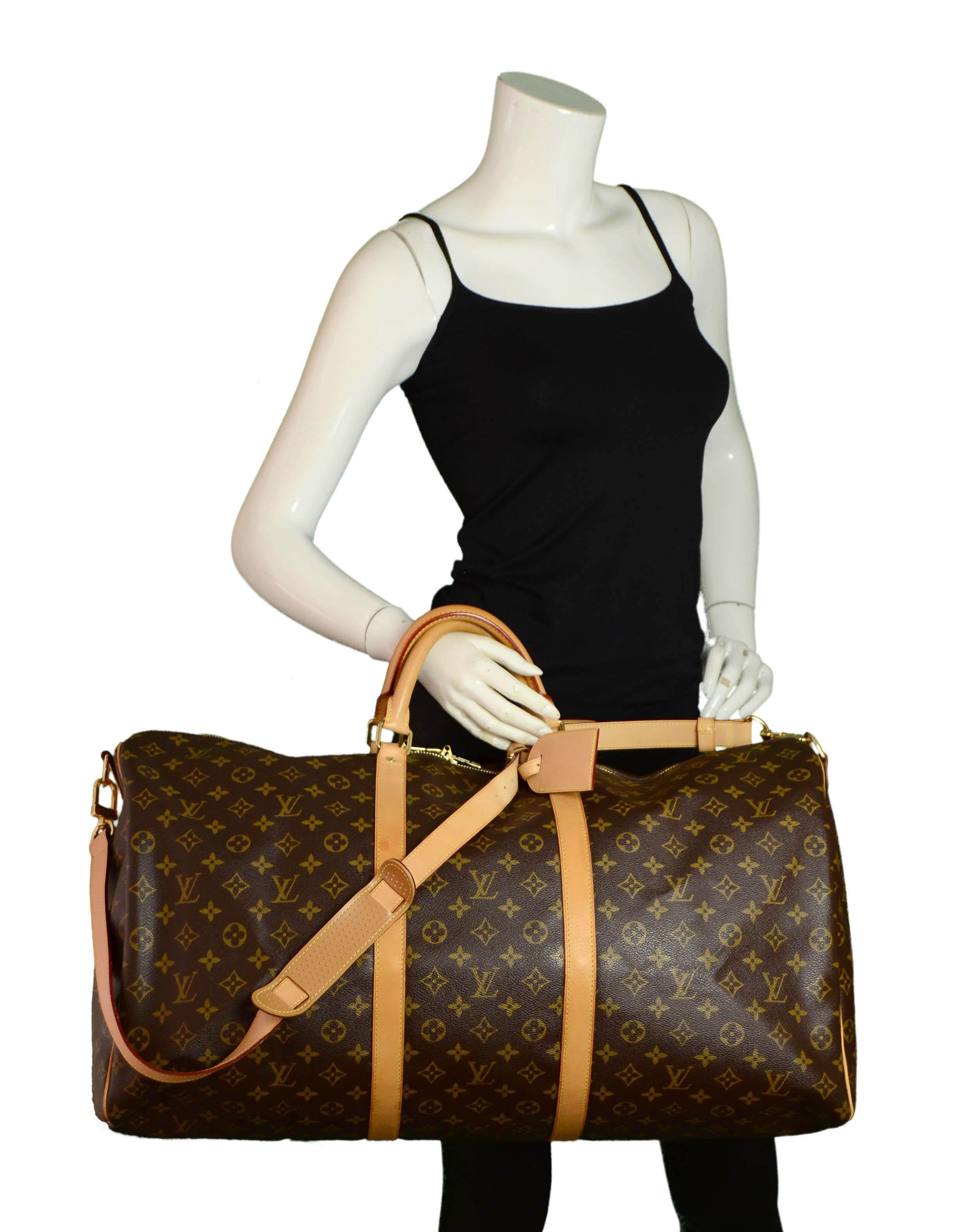 Louis Vuitton Monogram Keepall Bandouliere 60 Travel Duffle Bag

Made In: France
Year of Production: 2009
Color: Brown Monogram
Hardware: Goldtone
Materials: Coated canvas & vachetta leather
Lining: Canvas
Closure/Opening: Zip top
Exterior