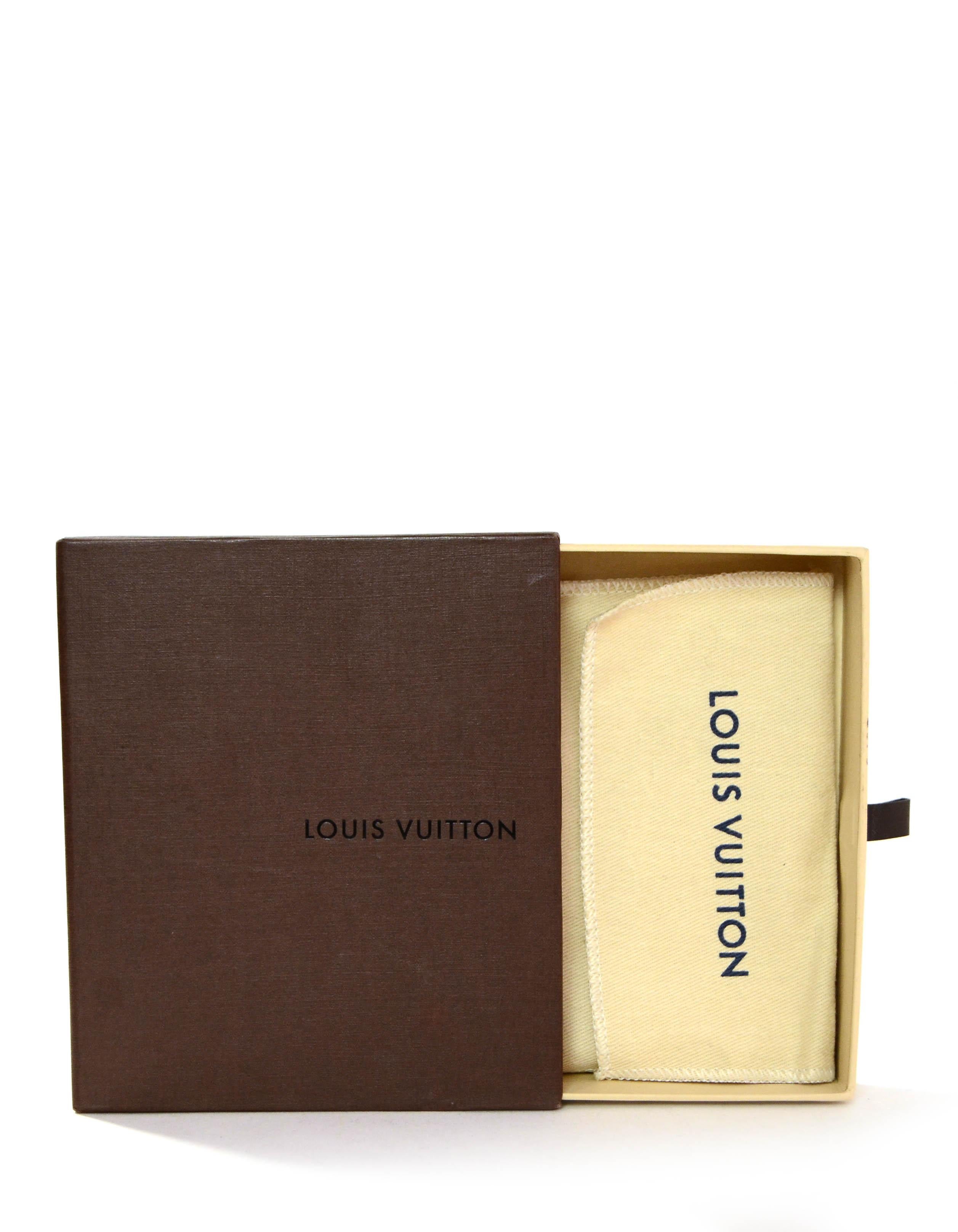 Louis Vuitton Monogram Key Pouch/ Coin Purse

Made In: Spain
Color: Brown
Hardware: Goldtone
Materials: Coated Canvas
Lining: Grained cow-hide leather
Closure/Opening: Zip top
Exterior Condition: Excellent
Interior Condition: Excellent 
Includes: