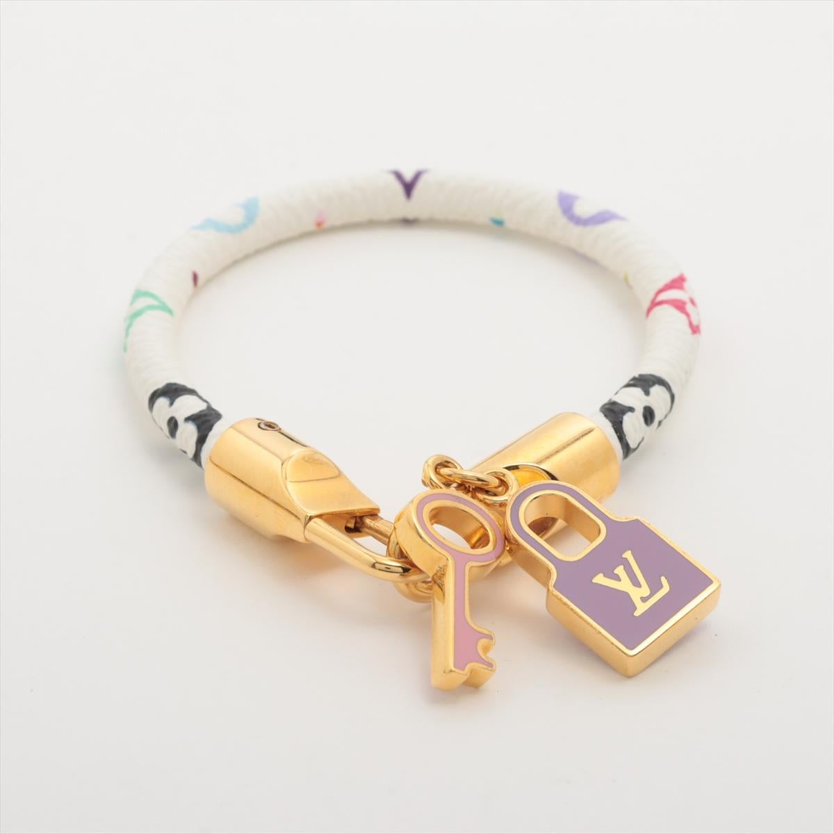 The Louis Vuitton Monogram Lockit Bracelet in Multicolor White a vibrant and chic accessory that seamlessly combines iconic design with contemporary style. The bracelet features classic Monogram pattern in a playful and fresh white multicolor