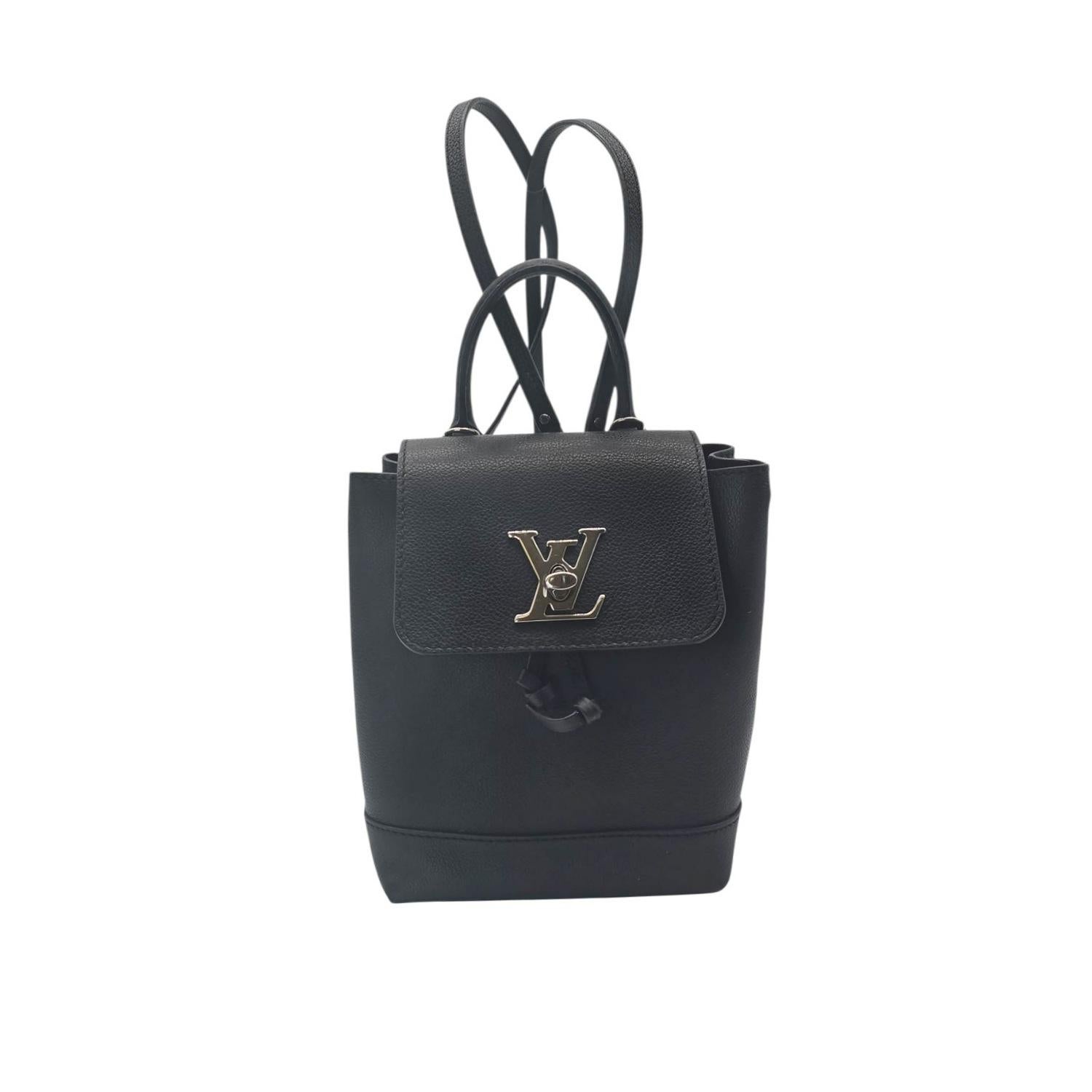 Elegant and practical, the 2019 Louis Vuitton Monogram Lockme Mini Backpack is crafted from supple black calfskin. It features versatile carrying options with adjustable straps, a top handle, and a signature silver LV turn-lock. The compact design