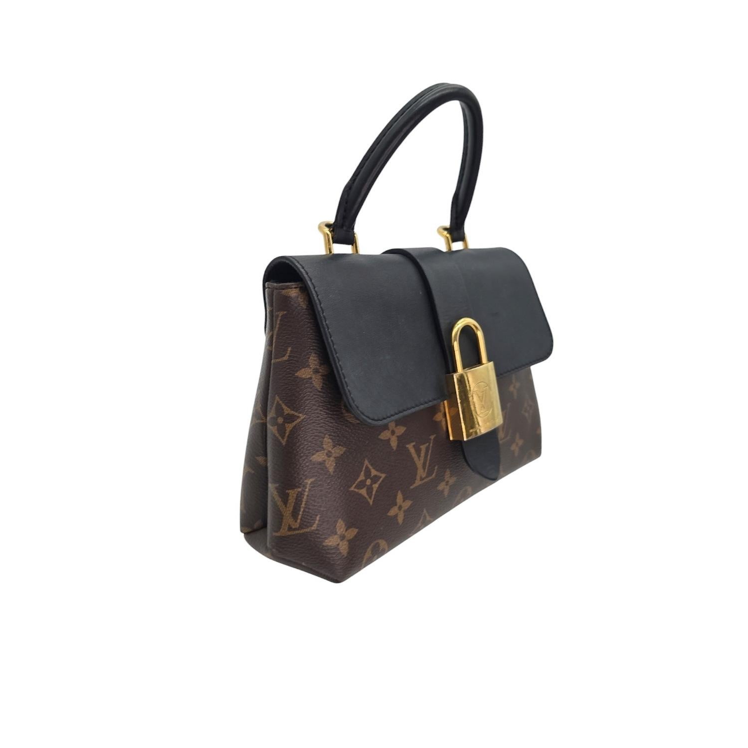 This Louis Vuitton Monogram Locky BB Black Handbag is the epitome of luxury and style. Made from the finest materials, such as monogram coated canvas and smooth cowhide leather, and featuring polished gold hardware, this handbag exudes