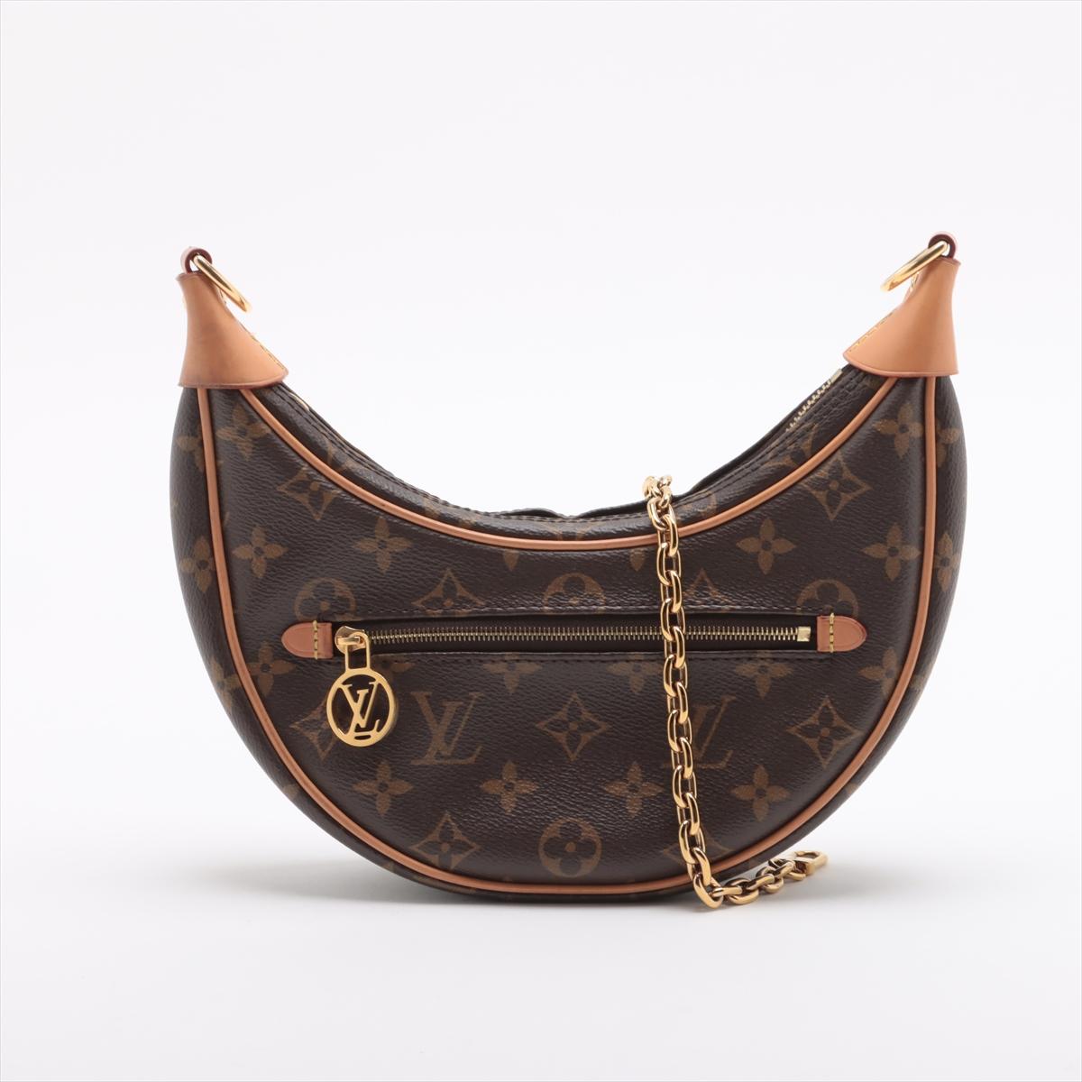 The Louis Vuitton Monogram Loop Shoulder Bag is a contemporary and stylish reinterpretation of the classic half-moon silhouette. Crafted from the brand’s signature Monogram canvas with natural leather trim, the chic bag features a compact yet