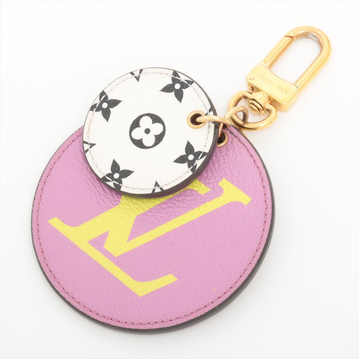 The Louis Vuitton Monogram LV Giant Initial Illustre Bag Charm in Lilac and Yellow features a dynamic and whimsical design with a playful blend of colors. The round-shaped charm showcases oversized LV initials in a vibrant combination of lilac and