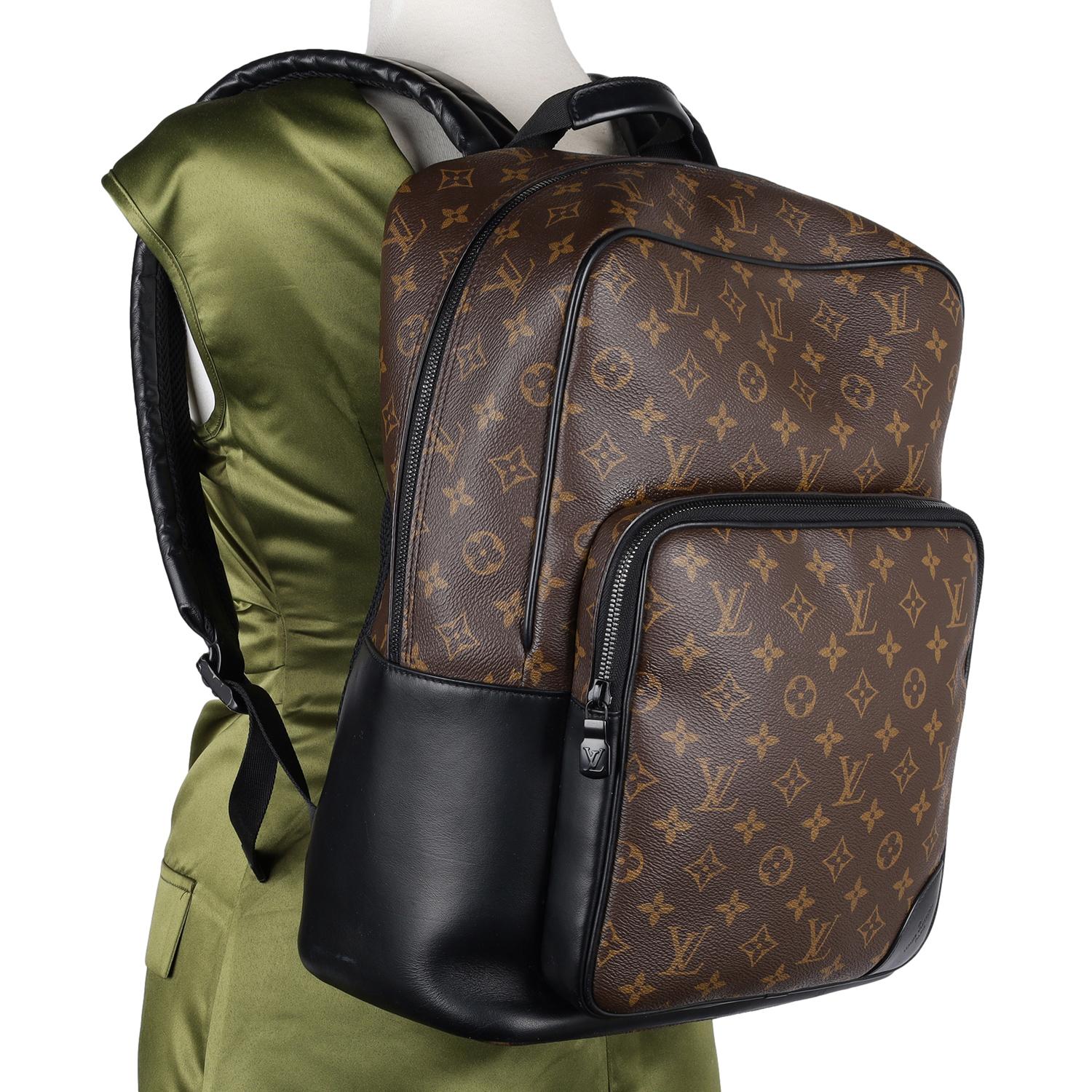 Authentic Louis Vuitton Monogram Macassar Dean Backpack. Features Louis Vuitton signature monogram coated canvas, smooth black leather trim, a front zipper pocket  compartment, black zipper closure, adjustable black leather shoulder straps. The