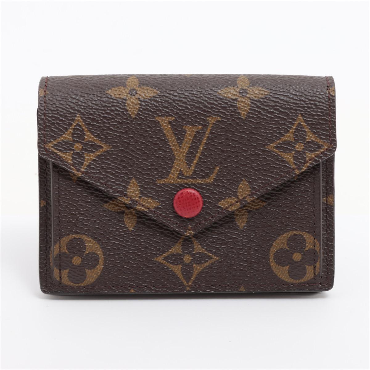 The Louis Vuitton Monogram Marie Wallet in Red is a chic and sophisticated accessory that combines luxury with functionality. Made from the brand's iconic Monogram canvas, it features a bold red leather interior, offering a vibrant contrast. The