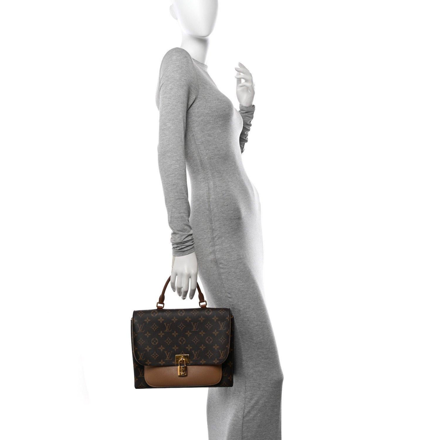 LOUIS VUITTON MONOGRAM MARIGNAN SESAME HANDBAG

This Louis Vuitton Marignan bag is made of signature monogram toile canvas with a smooth light brown leather front pocket and dark brown leather top handle. It features gold-tone hardware with a