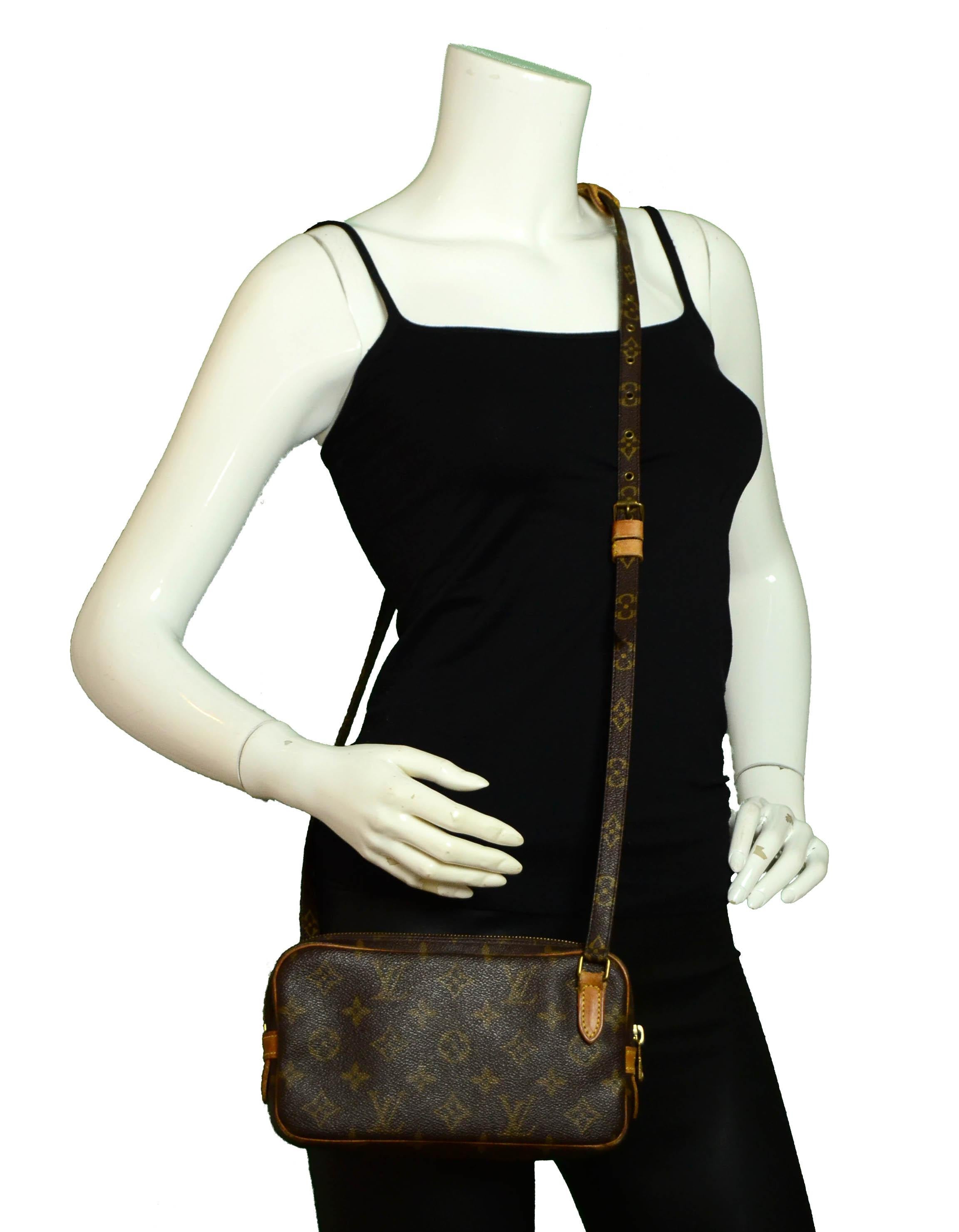 Louis Vuitton Monogram Marly Bandouliere Crossbody Bag

Made In: France
Year of Production: 1992
Color: Brown monogram
Hardware: Goldtone
Materials: Coated canvas & vachetta leather
Lining: Brown leather
Closure/Opening: Zipper
Exterior Condition: