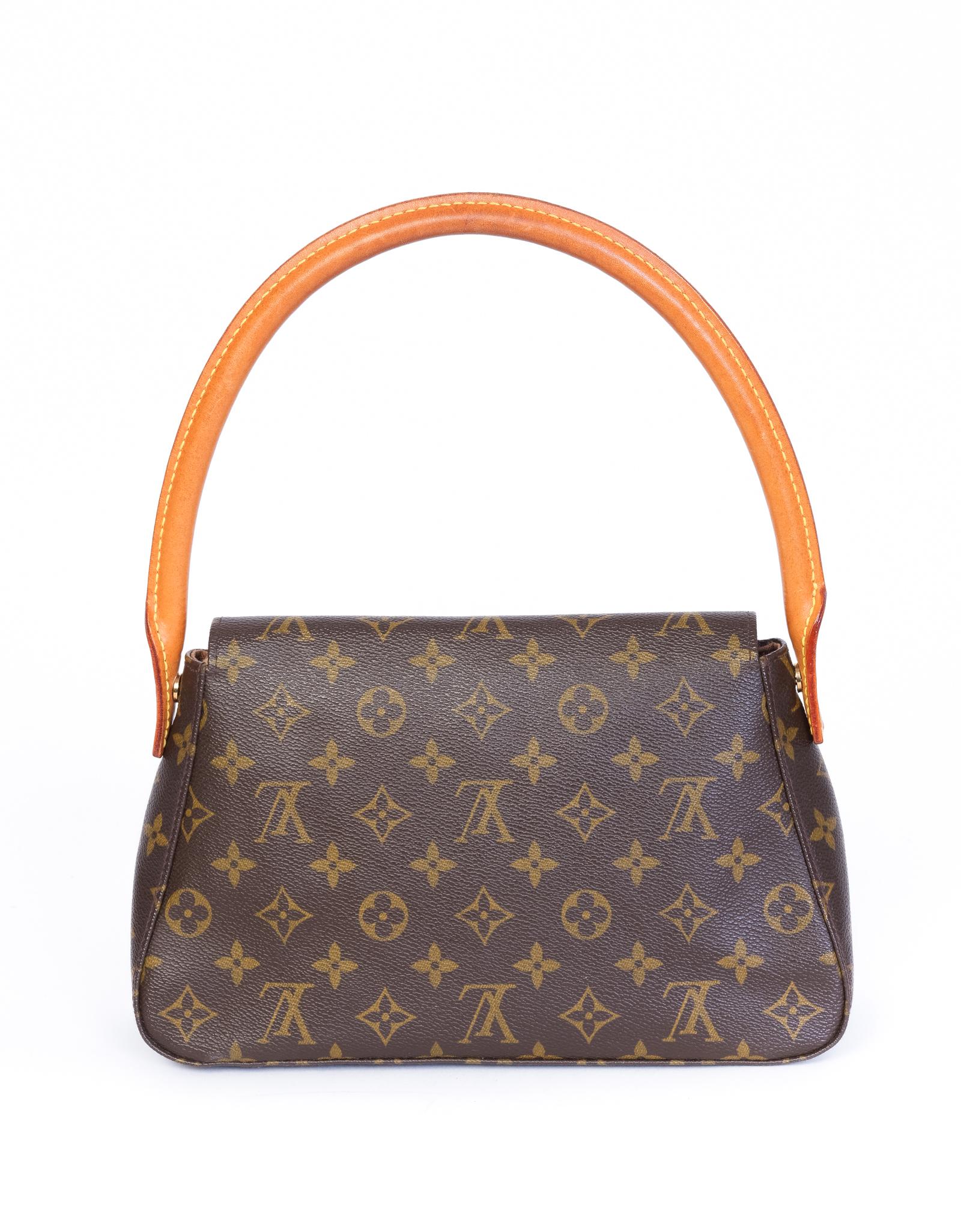 This Louis Vuitton Looping Bag is made with brown canvas with monogram print.  Featuring vachetta leather trim, gold toned hardware, a front flap with magnetic snap closure and a brown woven fabric interior lining with a single interior zip