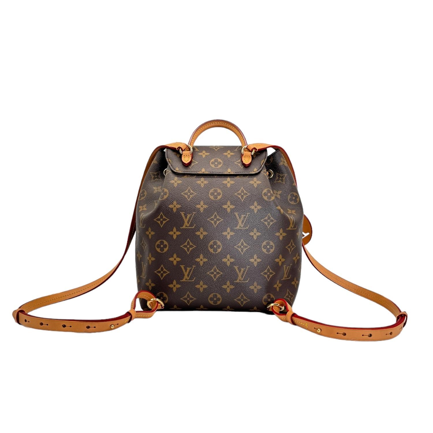 This stylish backpack is crafted of classic Louis Vuitton monogram on coated canvas in brown. It features vachetta leather trim, rolled vachetta handle, vachetta adjustable shoulder straps, and polished brass hardware. The front flap opens with a
