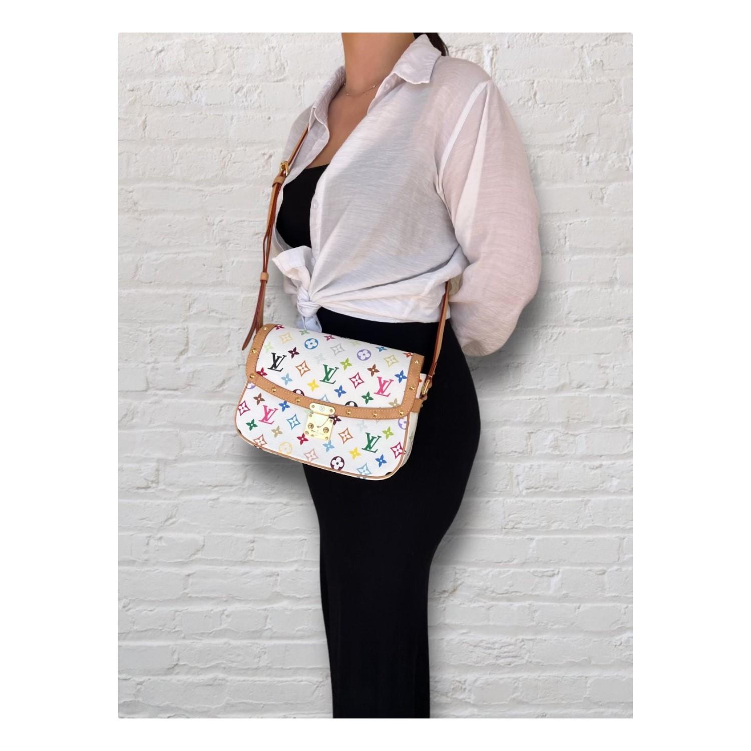 This Louis Vuitton Louis Vuitton Monogram Multicolor Sologne was made in France and it is finely crafted of the Louis Vuitton Monogram Multicolor coated canvas with leather trimming and gold-tone hardware features. It has an adjustable leather