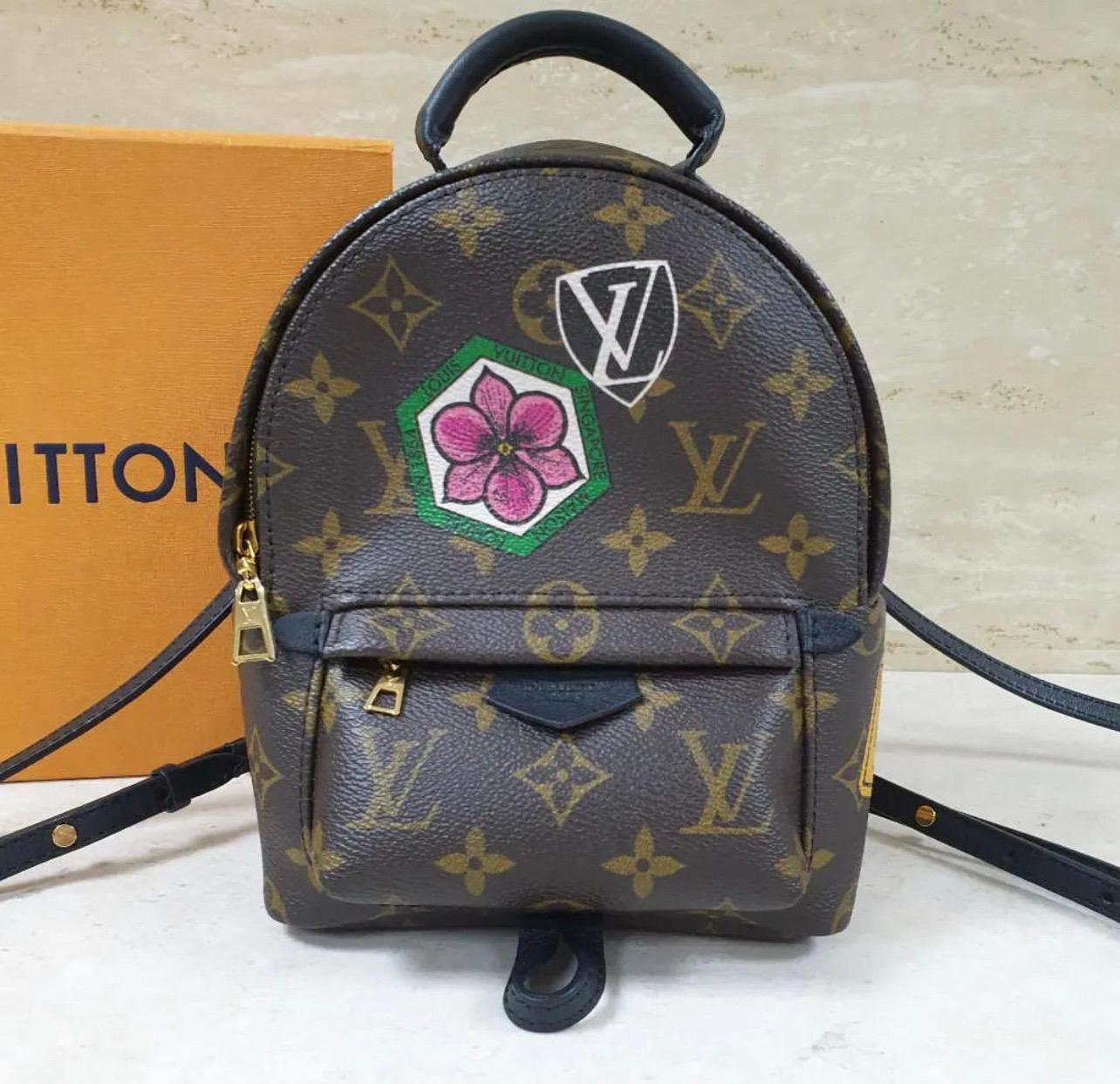 
This is an authentic LOUIS VUITTON Monogram My World Tour Palm Springs Backpack Mini.
This backpack features a body of sturdy monogram coated canvas with world tour badges and black calfskin accents.
The backpack features a front zipped pocket, a