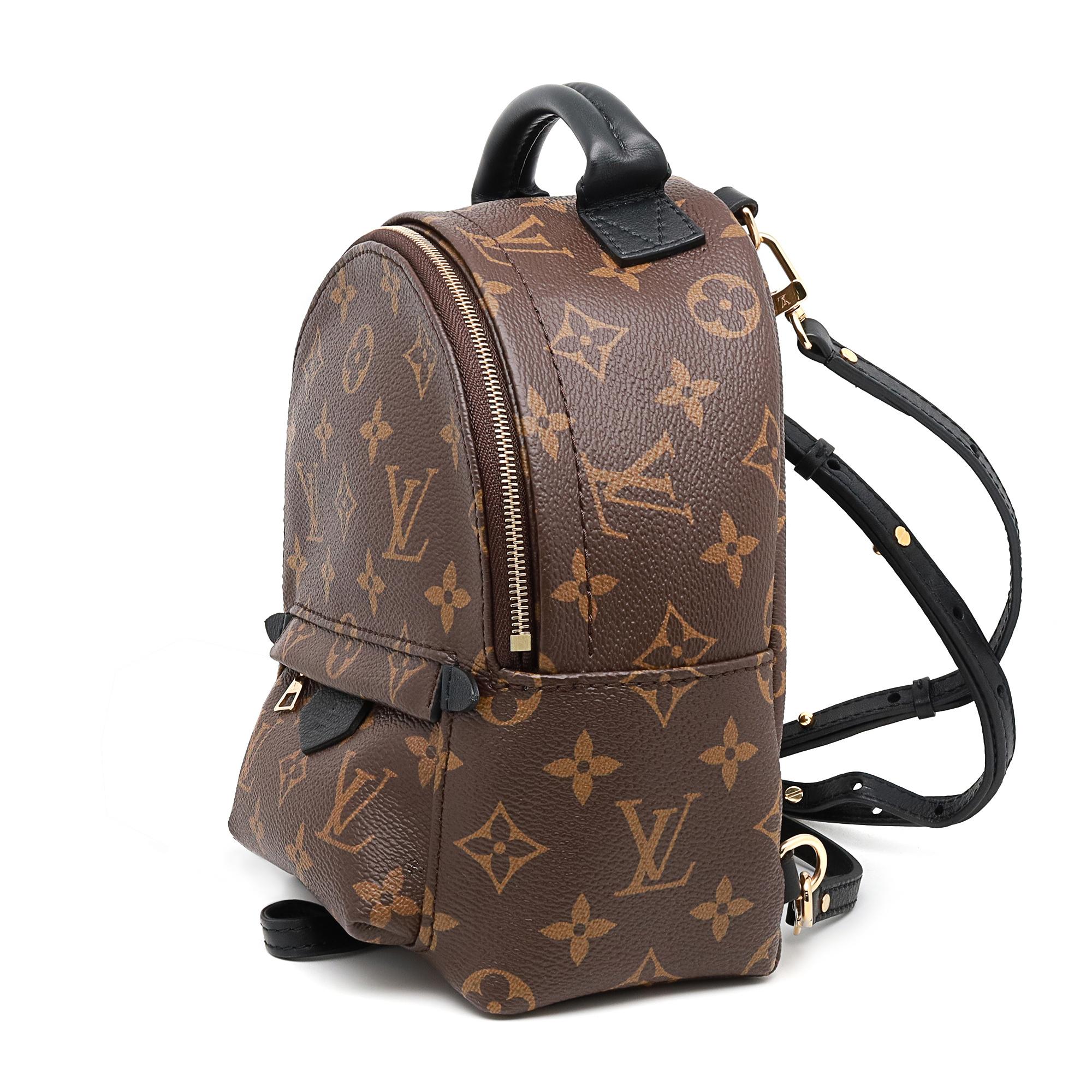 Louis Vuitton Monogram Palm Springs mini backpack. Featuring monogram coated brown canvas with black calfskin trim and a front zipped pocket. The backpack is reinforced with strong cowhide leather including a handle and adjustable leather shoulder