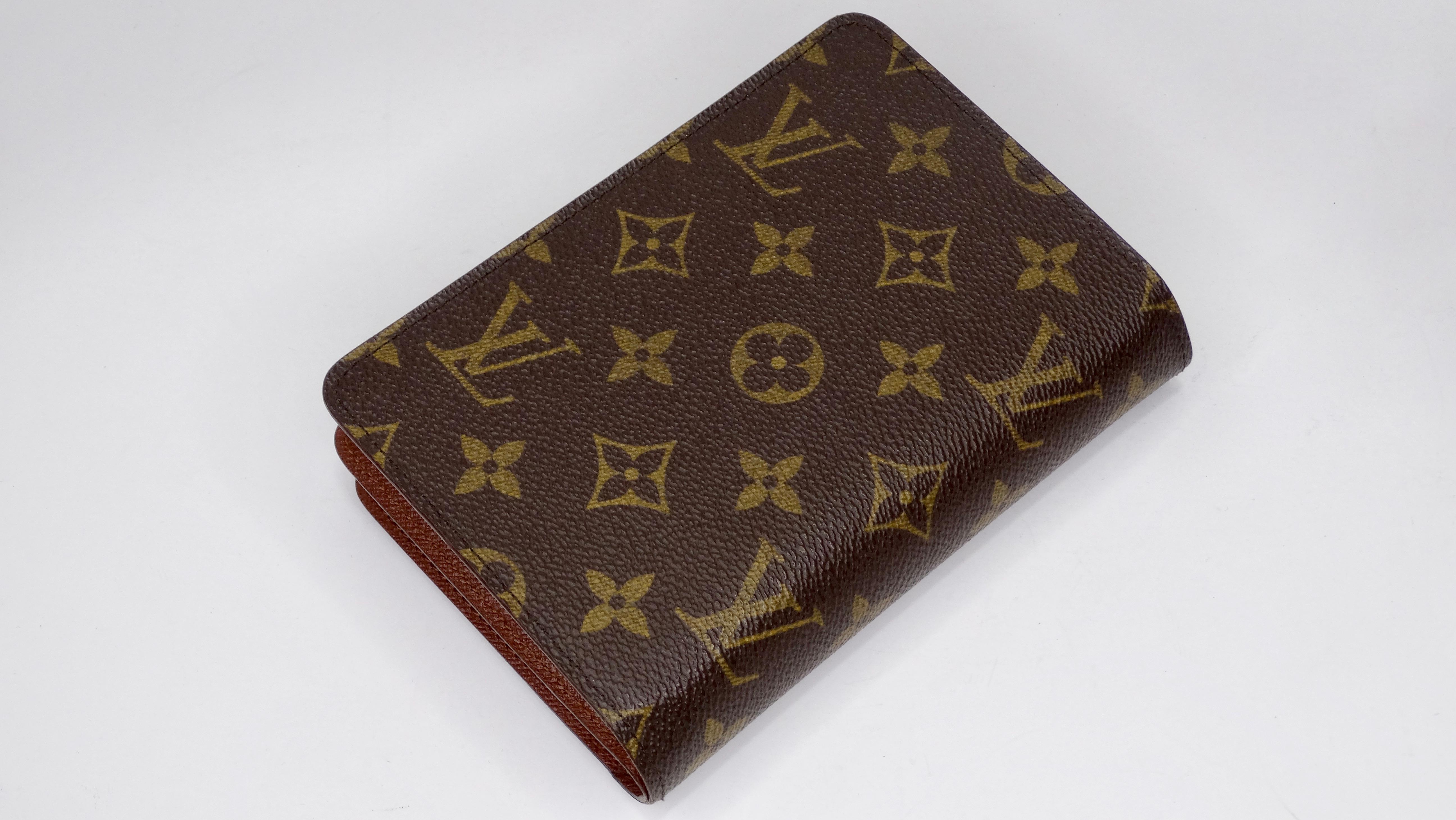 Get ready to travel! Circa 2001, this passport wallet features the signature LV monogram on the exterior. The snap button closure opens up to 6 card slots, a bill compartment, a detachable photo/card case and two wide slots. The LV zipper closure