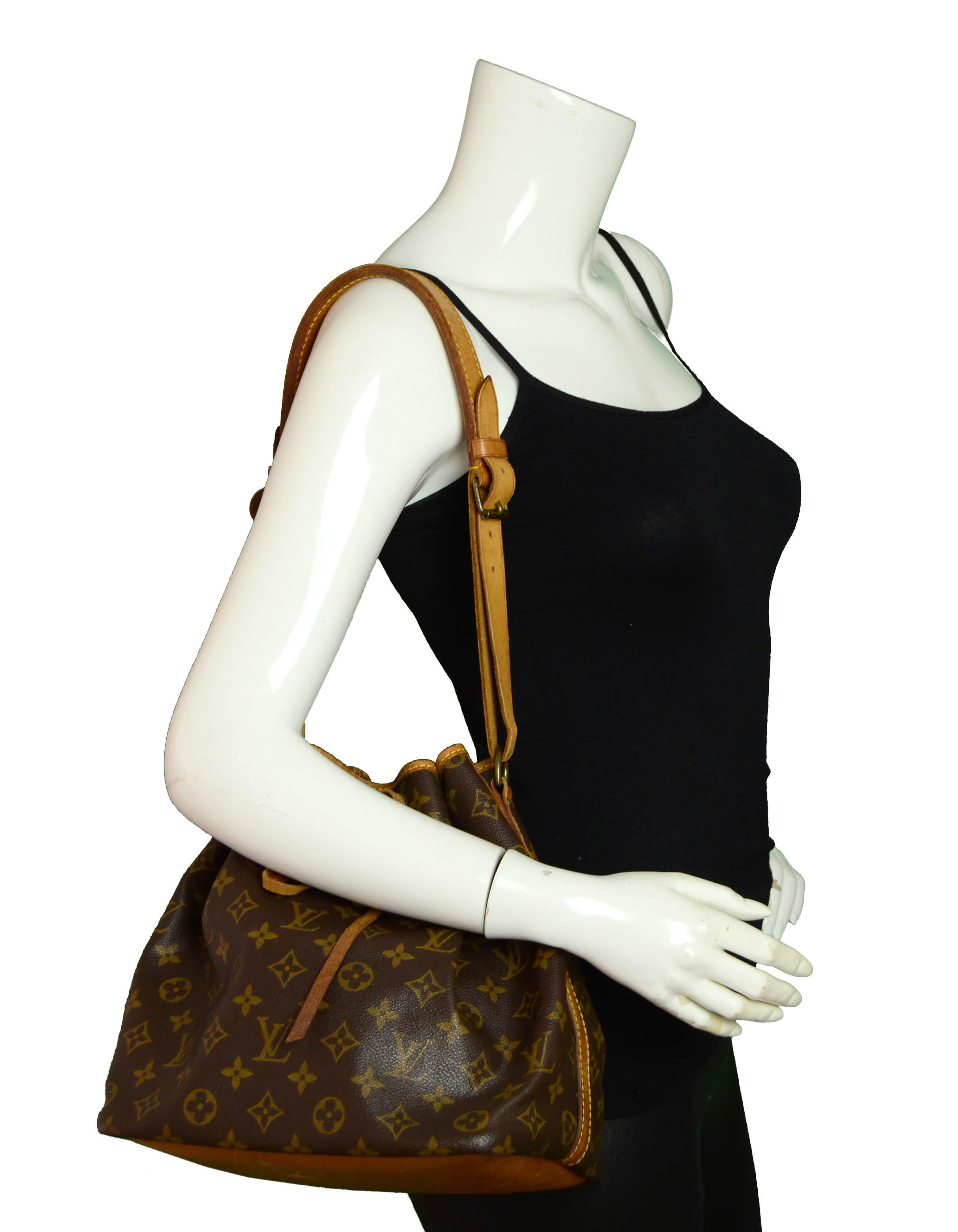 Louis Vuitton Monogram Petit Noe Bucket Bag

Made In: Malletier, France
Year of Production: 1989
Color: Brown monogram
Hardware: Goldtone
Materials: Coated Canvas
Lining: Canvas
Closure/Opening: Drawstring
Exterior Condition: Good - wear & staining