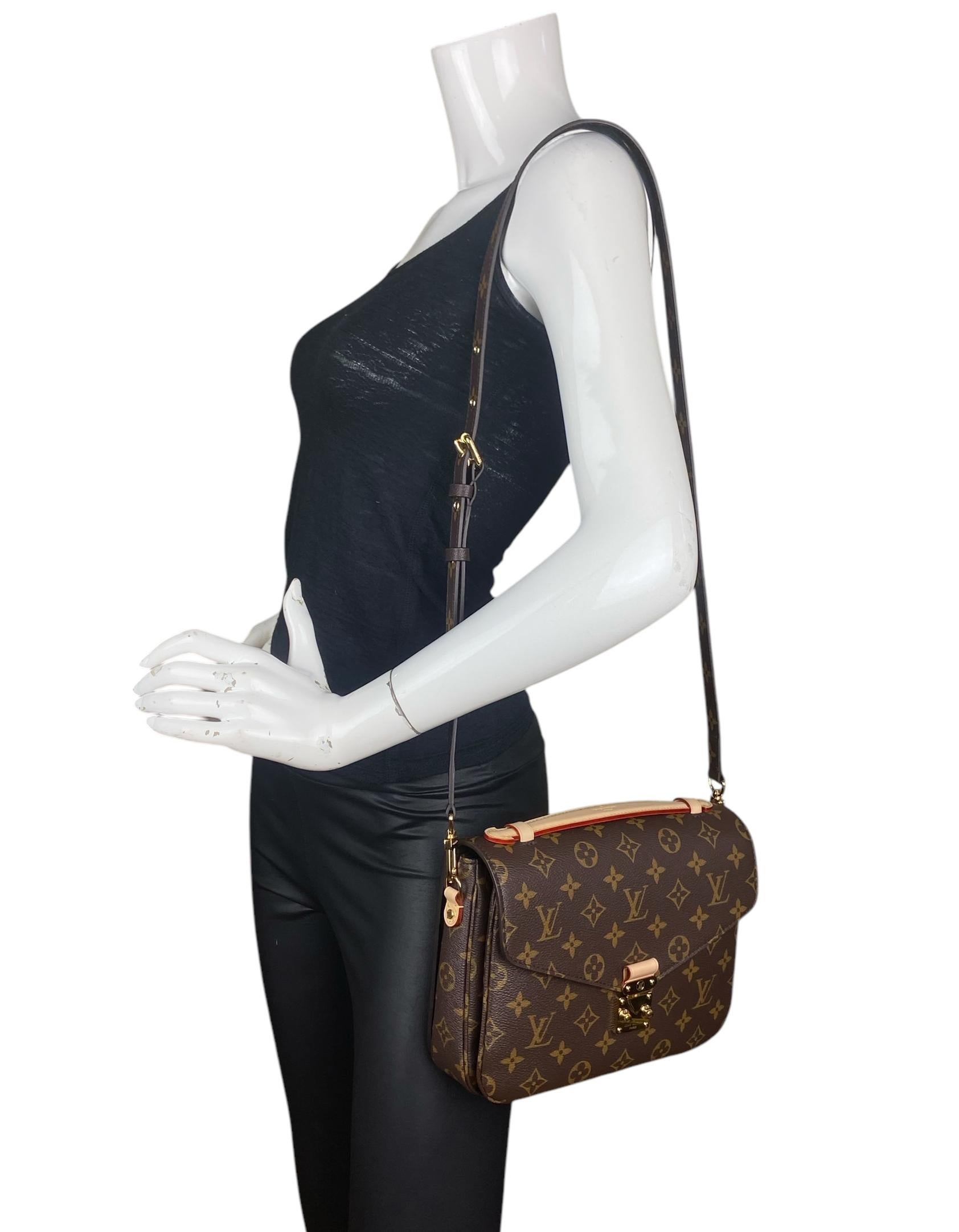 Louis Vuitton Monogram Pochette Metis Messenger Bag

Made In: France
Color: Brown, tan, beige
Hardware: Goldtone
Materials: Coated canvas and vachetta leather trim
Lining: Brown alcantara
Closure/Opening: Flap top with s-lock
Exterior Pockets: Back