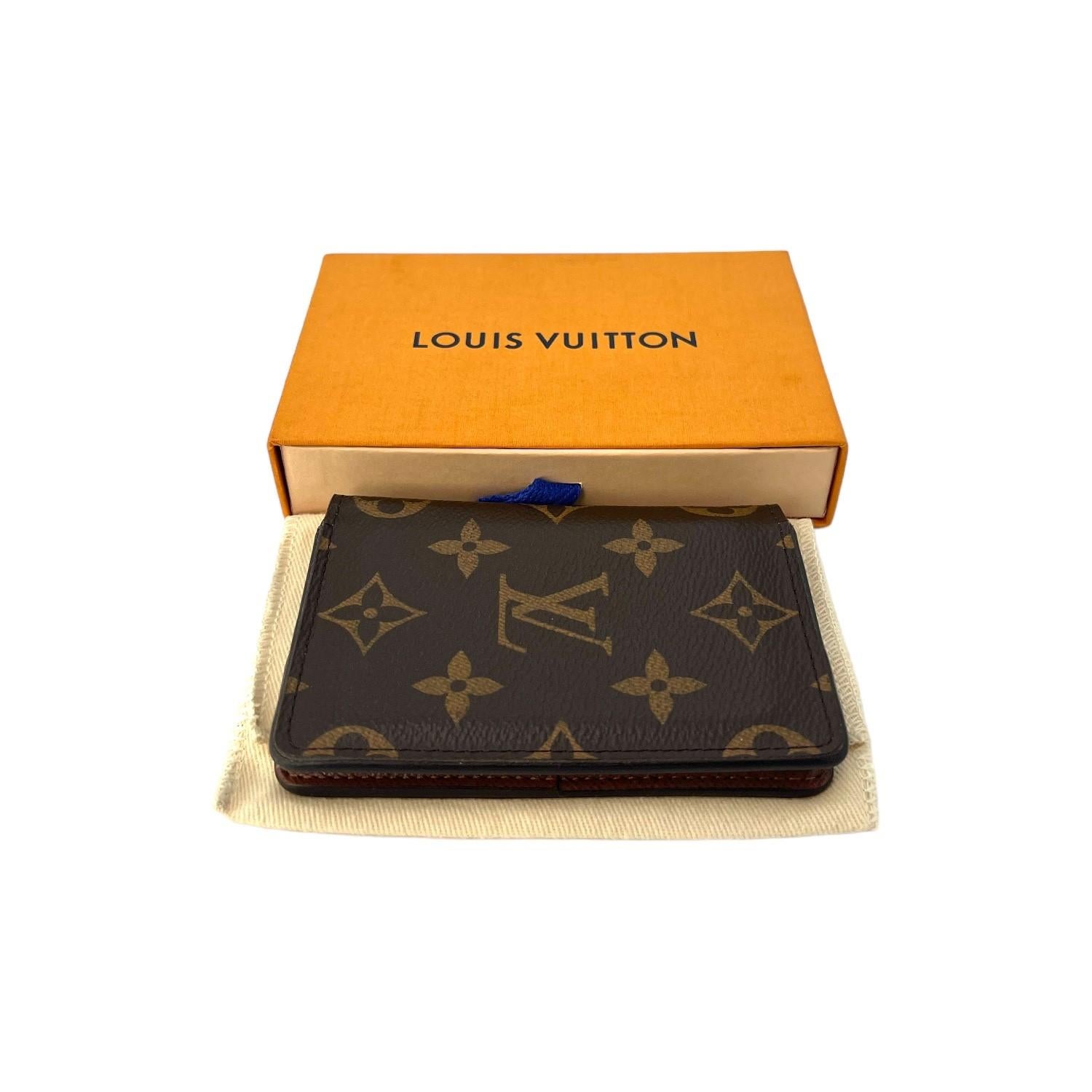 This Louis Vuitton Pocket Organizer was made in France and it is finely crafted of the classic Louis Vuitton Monogram coated canvas and leather exterior. There is a slip pocket on the backside. It has a fold closure that opens up to a leather