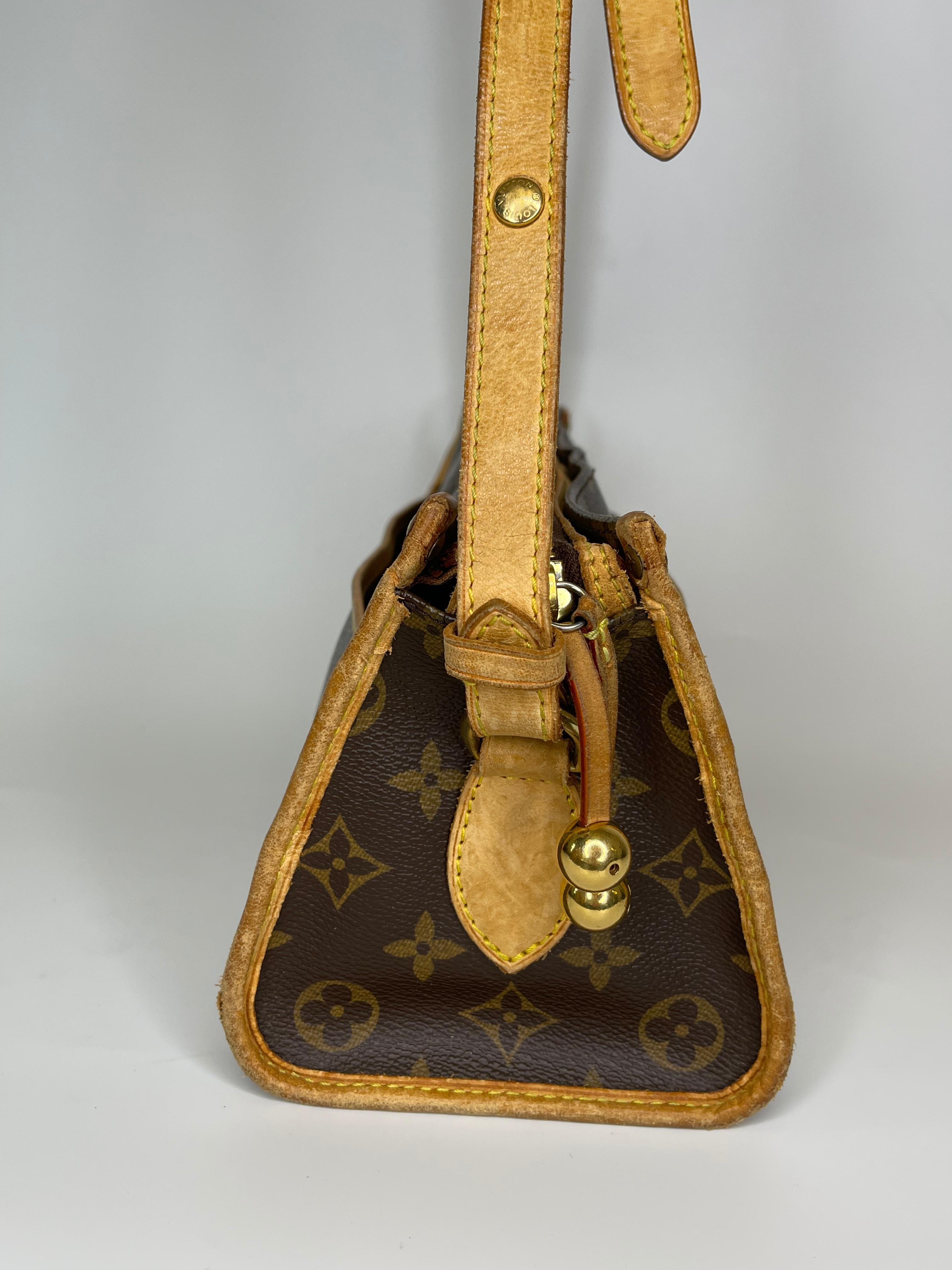 This iconic Louis Vuitton Monogram Popincourt Long Crossbody/Shoulder Bag features a traditional monogram canvas trimmed with vechetta leather with a total of four slip pockets on the exterior, vachetta shoulder strap adjustable allowing the bag to