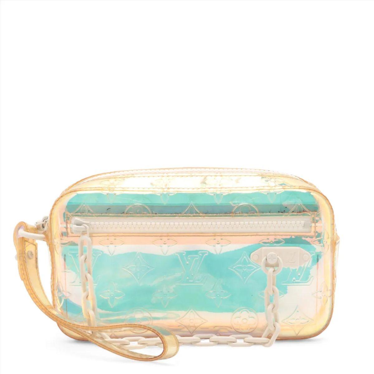 The Louis Vuitton Monogram Prism Pochette Volga is a striking and futuristic accessory that reimagines classic elegance with an avant-garde twist. Crafted from iridescent PVC material embossed with the iconic Monogram pattern, the bag captivates