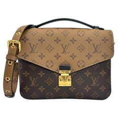 Messenger Pochette Louis Vuitton Monograma Reverso Metis