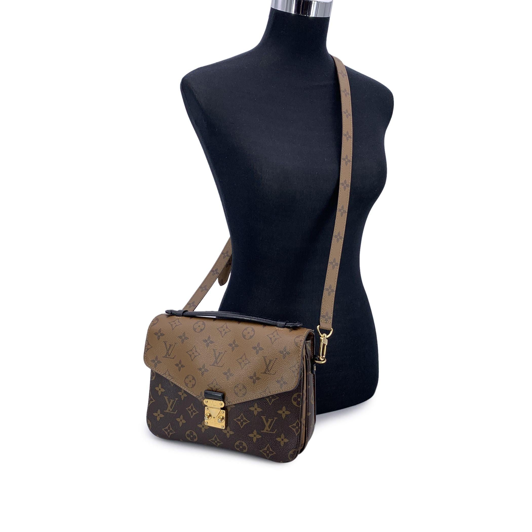 This beautiful Bag will come with a Certificate of Authenticity provided by Entrupy. The certificate will be provided at no further cost. Step into the world of timeless elegance with this beautiful Louis Vuitton 'Pochette Metis' handbag. Crafted in