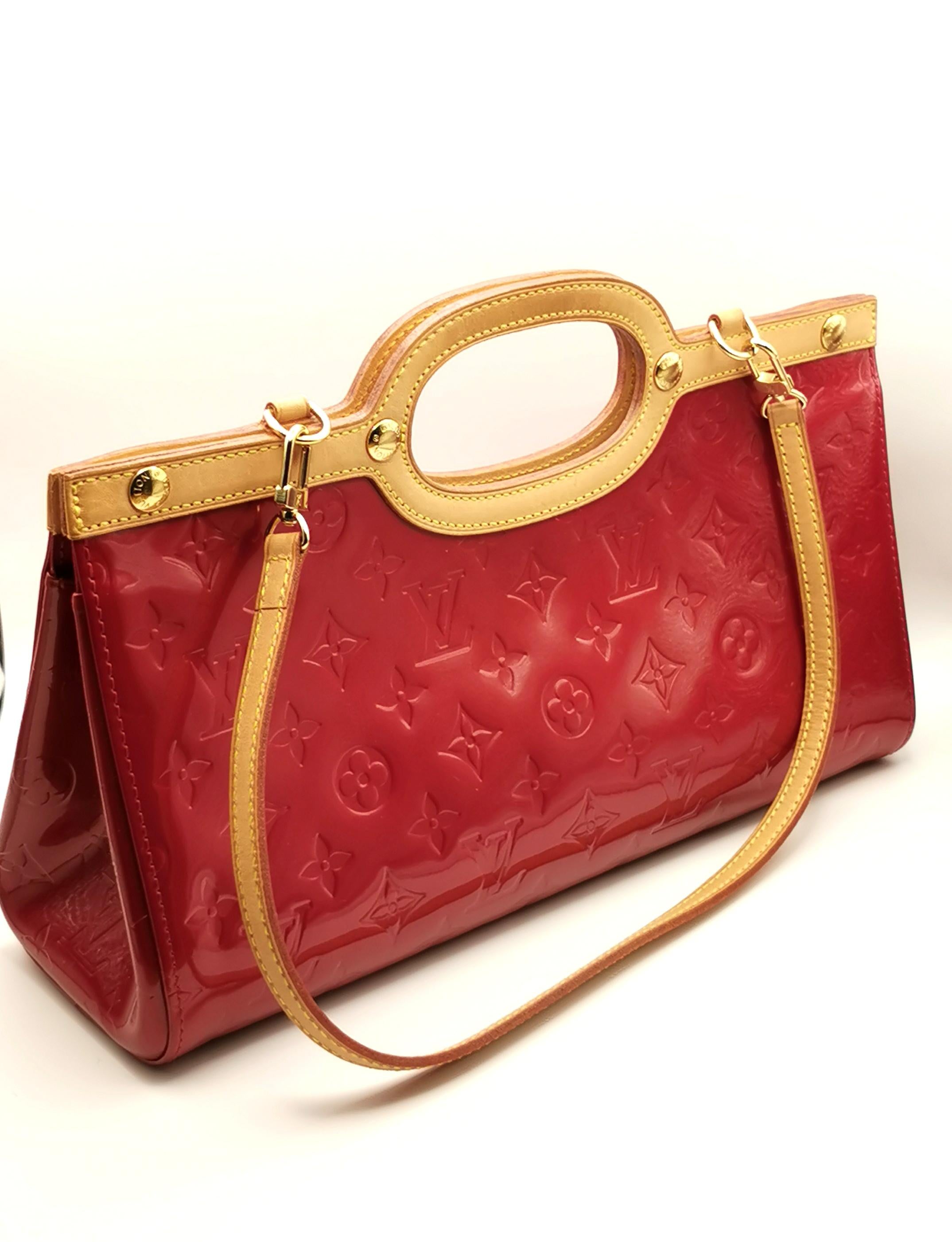 You can't go wrong with a splash of colour from this gorgeous Louis v
Vuitton handbag. 

Rich red vernis leather monogram fabric, this is the Roxbury Drive Pomme D'amour model. 

The bag is an elongated shape with the body made up from the signature