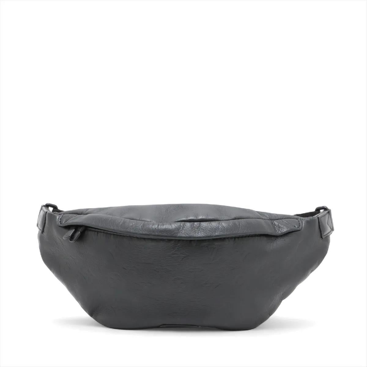 The Louis Vuitton Monogram Shadow Discovery Bum Bag PM is a sleek and versatile accessory crafted from supple leather embossed with the subtle Monogram Shadow pattern. Designed with a modern silhouette, it offers both style and practicality, perfect