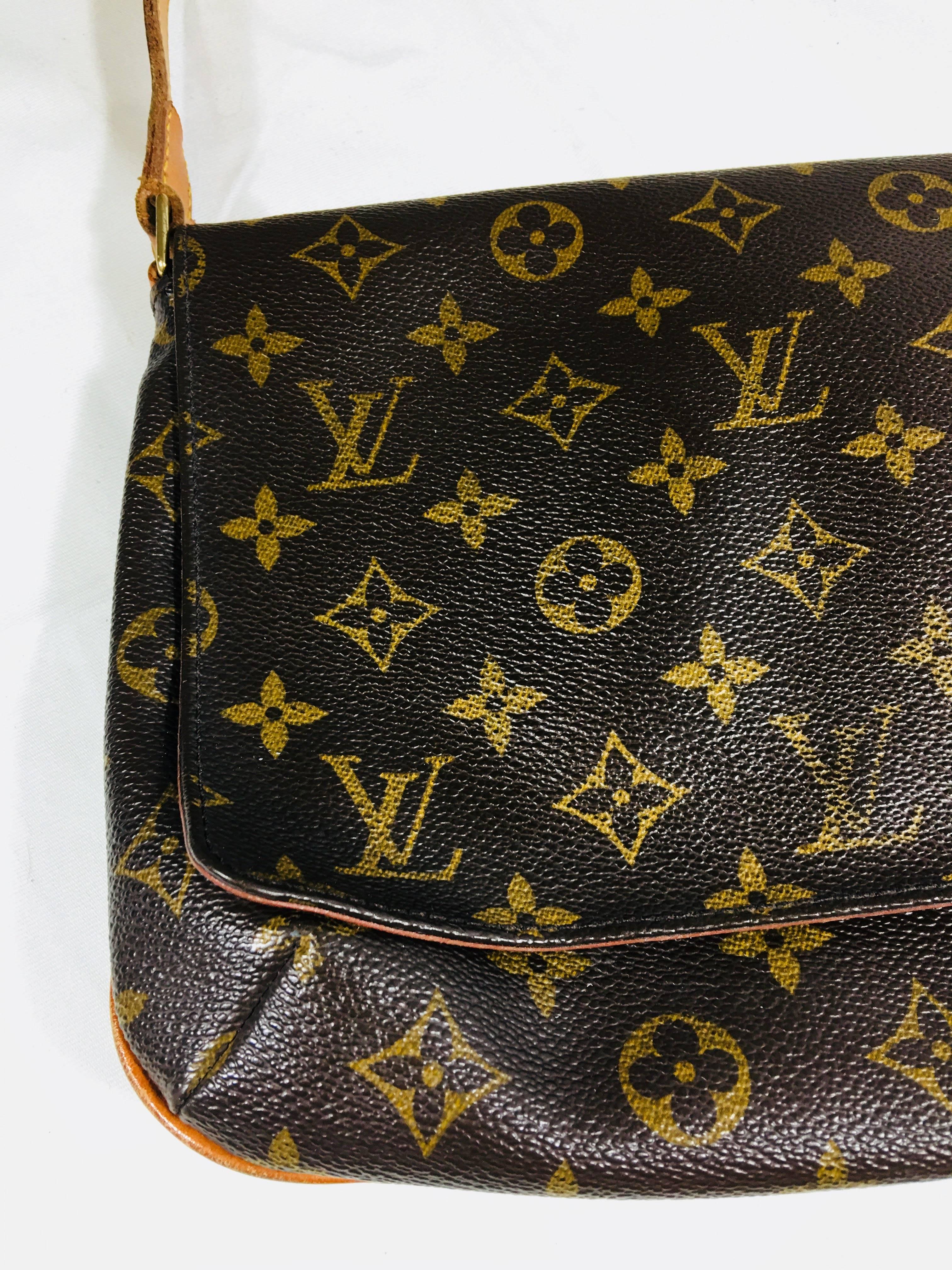 Louis Vuitton Monogram Shoulder Bag. Chocolate/Tan Leather with LV Monogram Throughout. Magnetic Closure, Leather Trim, and Gold Hardware.
Wear on Interior.