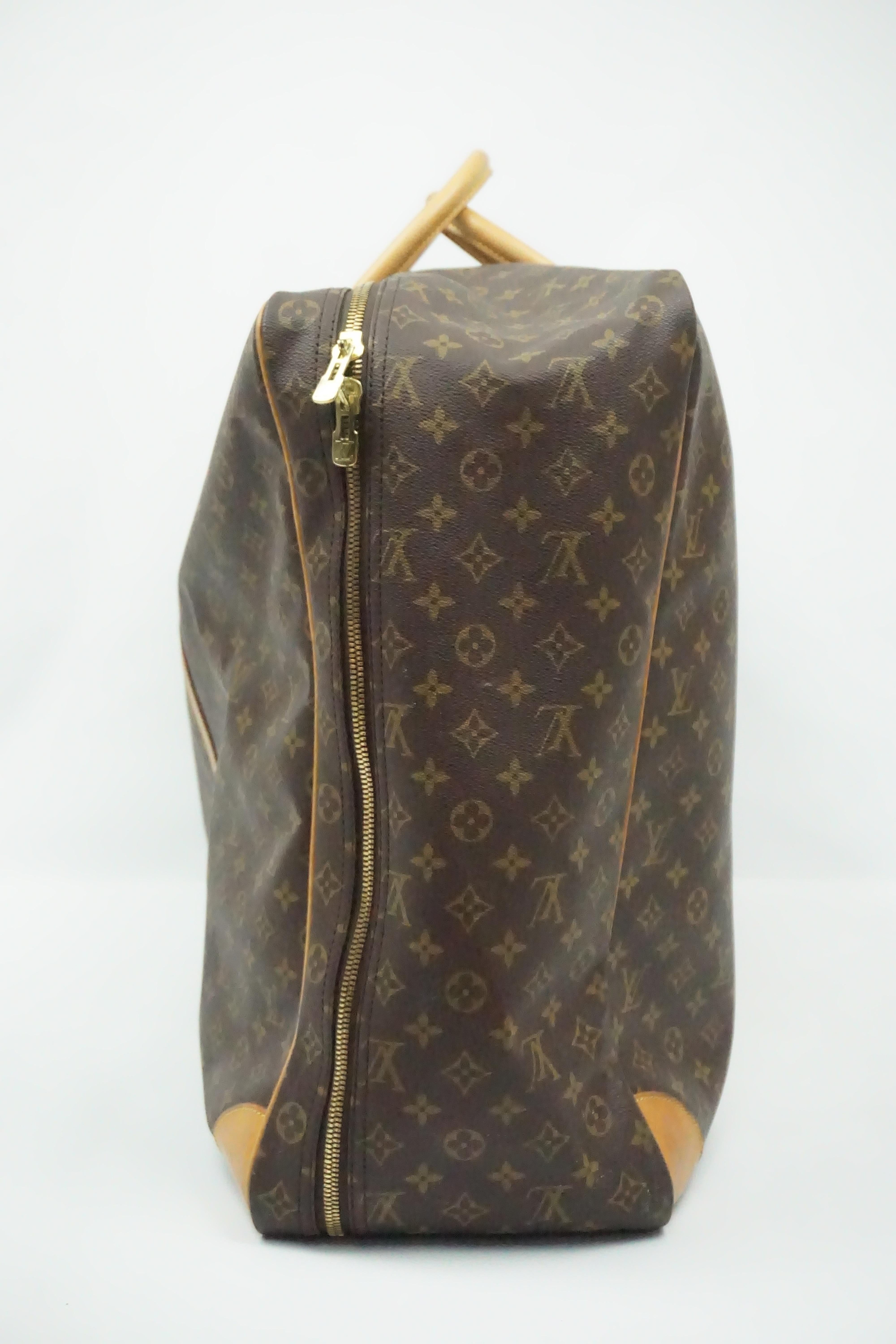 Louis Vuitton Monogram Sirius 70 Large Luggage This beautiful luggage is in good condition. The luggage does have some wear to it but still looks good as new. There are two beige handles and two beige leather strips running down the front. There is
