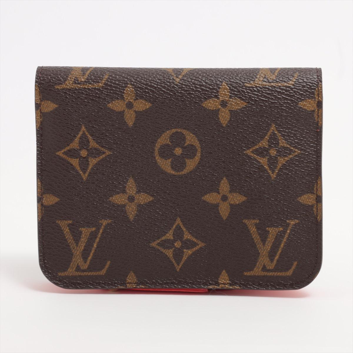 The Louis Vuitton Monogram Small Bi-fold Wallet in Orange is a stylish and compact accessory that exudes luxury and sophistication. Crafted from the brand's iconic Monogram canvas, the wallet features a vibrant orange hue that adds a pop of color to