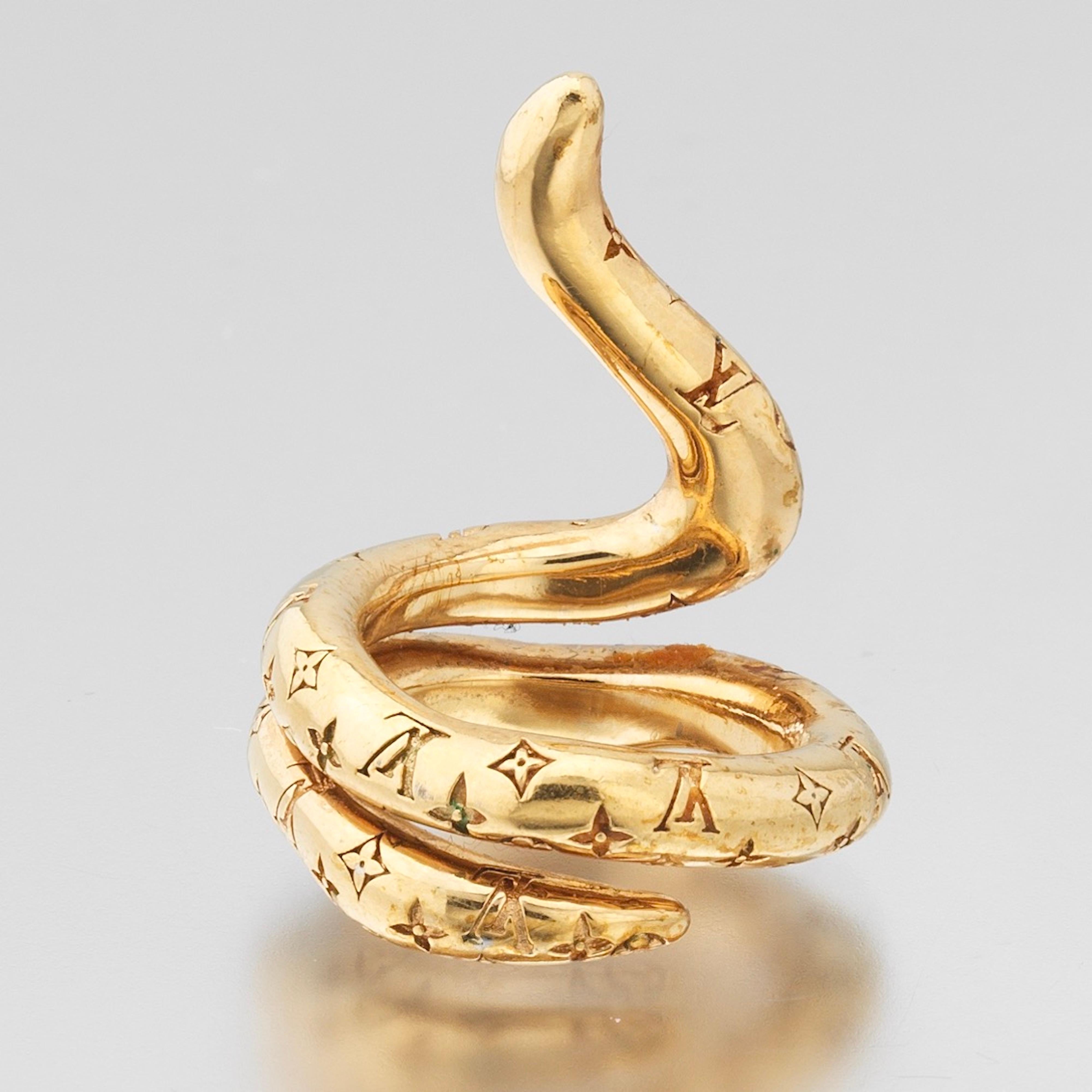 Louis Vuitton Monogram Snake Ring. Gold tone metal with LV monogram motif, made in Italy, marked on the inside of the ring.
Ring size 4-4.5
