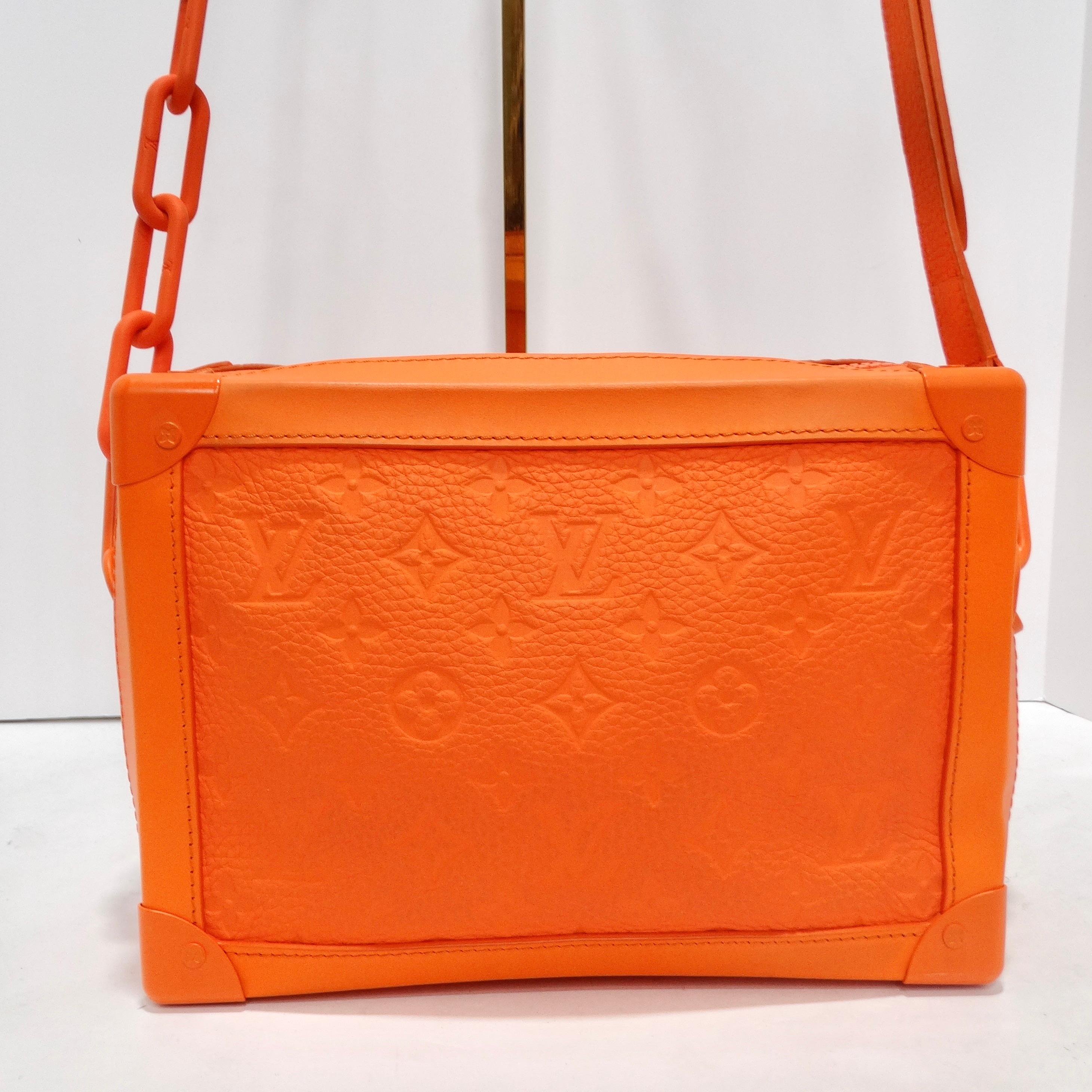 Immerse yourself in the epitome of luxury with the Louis Vuitton Monogram Soft Trunk in captivating orange. This incredible square mini trunk, crafted from bright orange monogram soft leather, is a testament to Louis Vuitton's commitment to