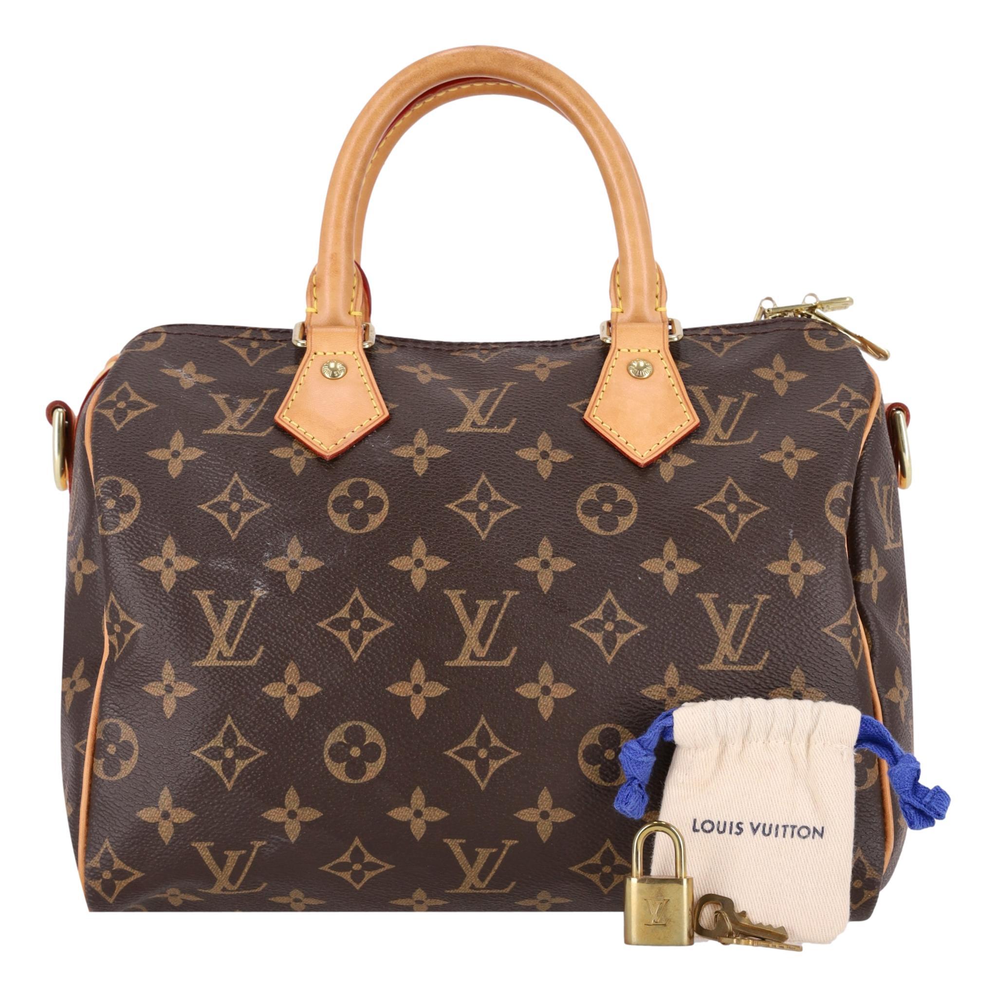 Louis Vuitton Monogram Speedy 25 Coated Canvas Handbag

Brown bag crafted from LV's signature monogram coated canvas.

Featuring beige leather trims and dual rolled top handle.

Gold branded hardware, padlock and keys with zipped top leading to