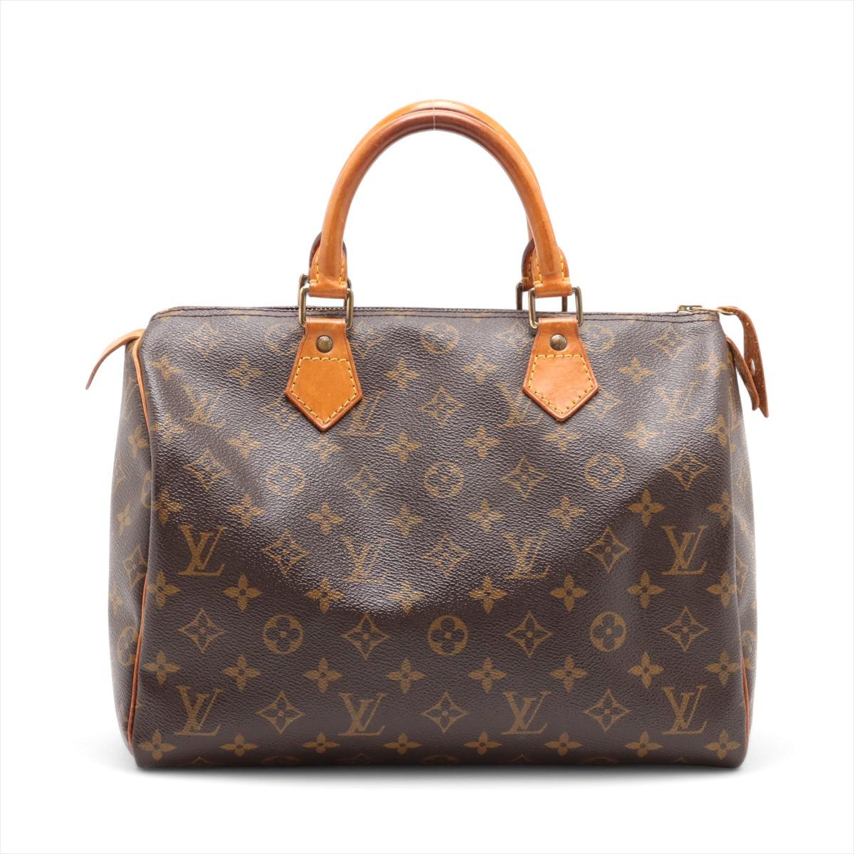 The Louis Vuitton Monogram Speedy 30 is a classic and sophisticated handbag, crafted from the iconic monogram canvas. Featuring rolled leather top handles, the timeless piece offers a structured yet stylish silhouette. Its spacious interior provides