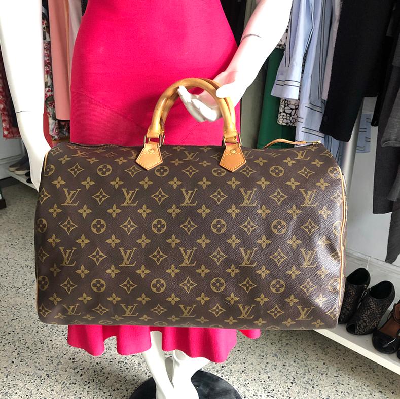Louis Vuitton Monogram Speedy 40 Bag.  Double rolled vachetta leather handles, roomy interior, zippered top.  Date code MB0940 for production year 2000. Measures 16 x 10 x 8”. Excellent pre-owned condition with some light wear to leather as pictured