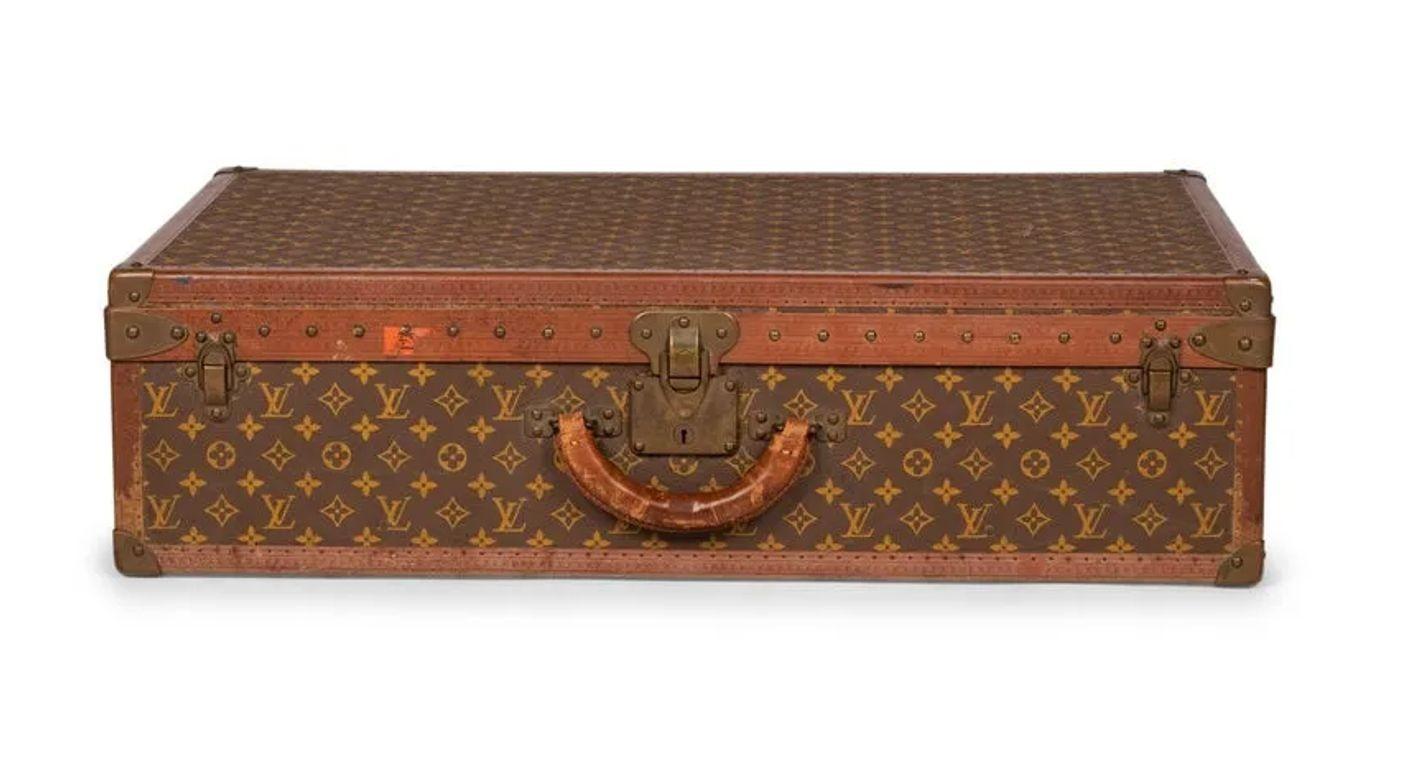 Louis Vuitton Monogram Suitcase / Trunk, Alzer 80, Mid 20th Century

A Louis Vuitton Monogramed Hard Suitcase. In good to fair condition. Sticker and missing the interior tray.

IZSA

9H x 31.5W x 20.5D