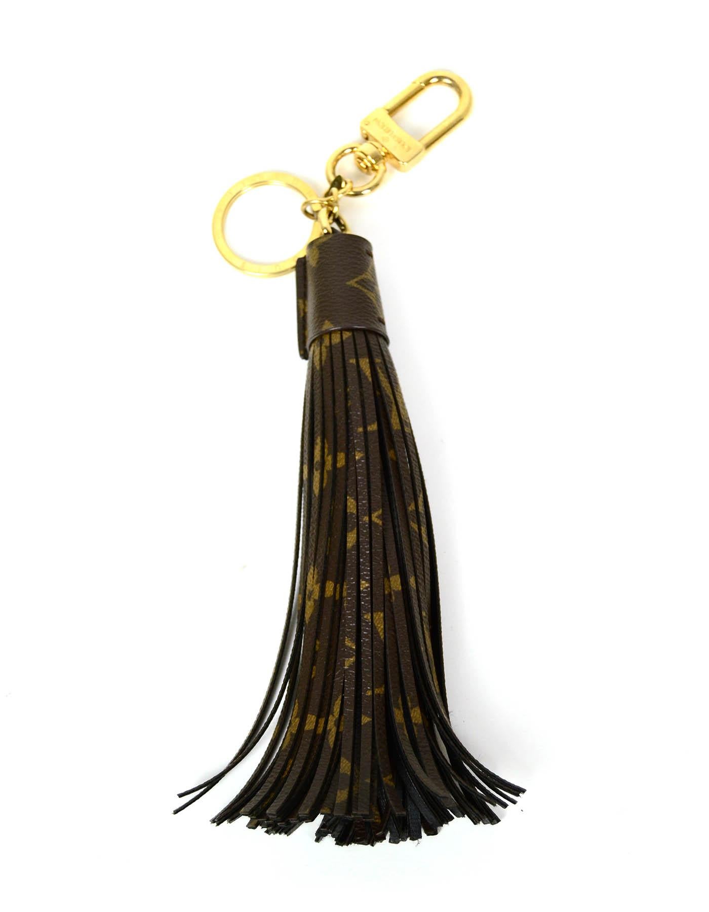 Louis Vuitton Monogram Tassel Bag Charm/ Key Ring

Made In: Italy
Color: Brown 
Hardware: Goldtone
Materials: Coated canvas, metal
Condition: Excellent pre-owned condition

Measurements:
10.75