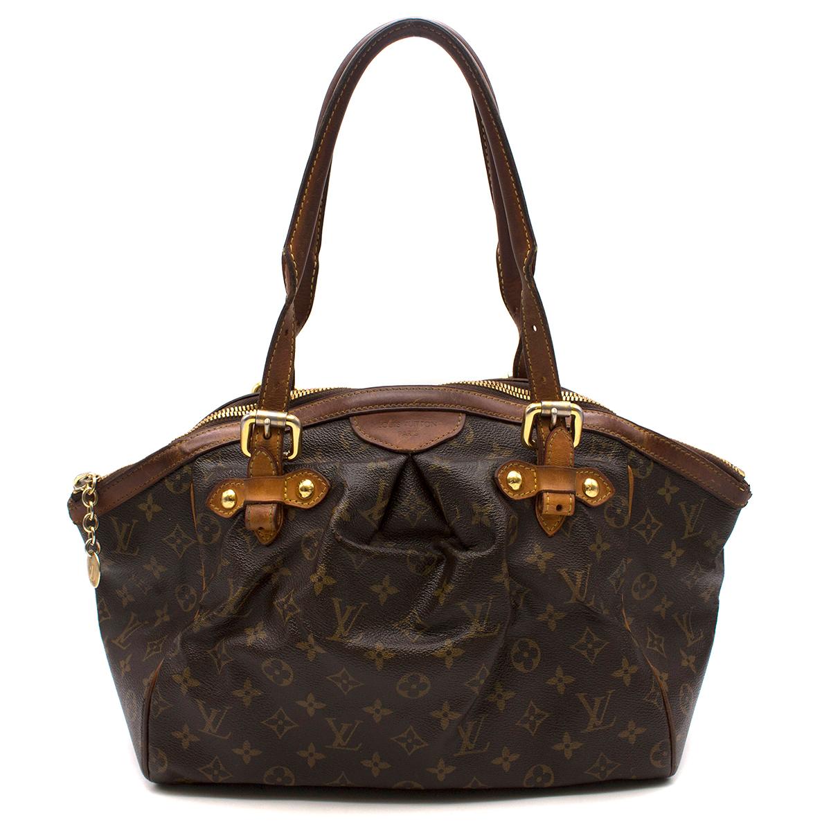 Louis Vuitton Monogram Tivoli GM Handbag

- Brown, monogram canvas leather handbag
- Rolled adjustable top handles
- Top zip fastening
- Main large compartment
- Internal two patch pockets and a phone holder pocket
- Five protective metal feet
-