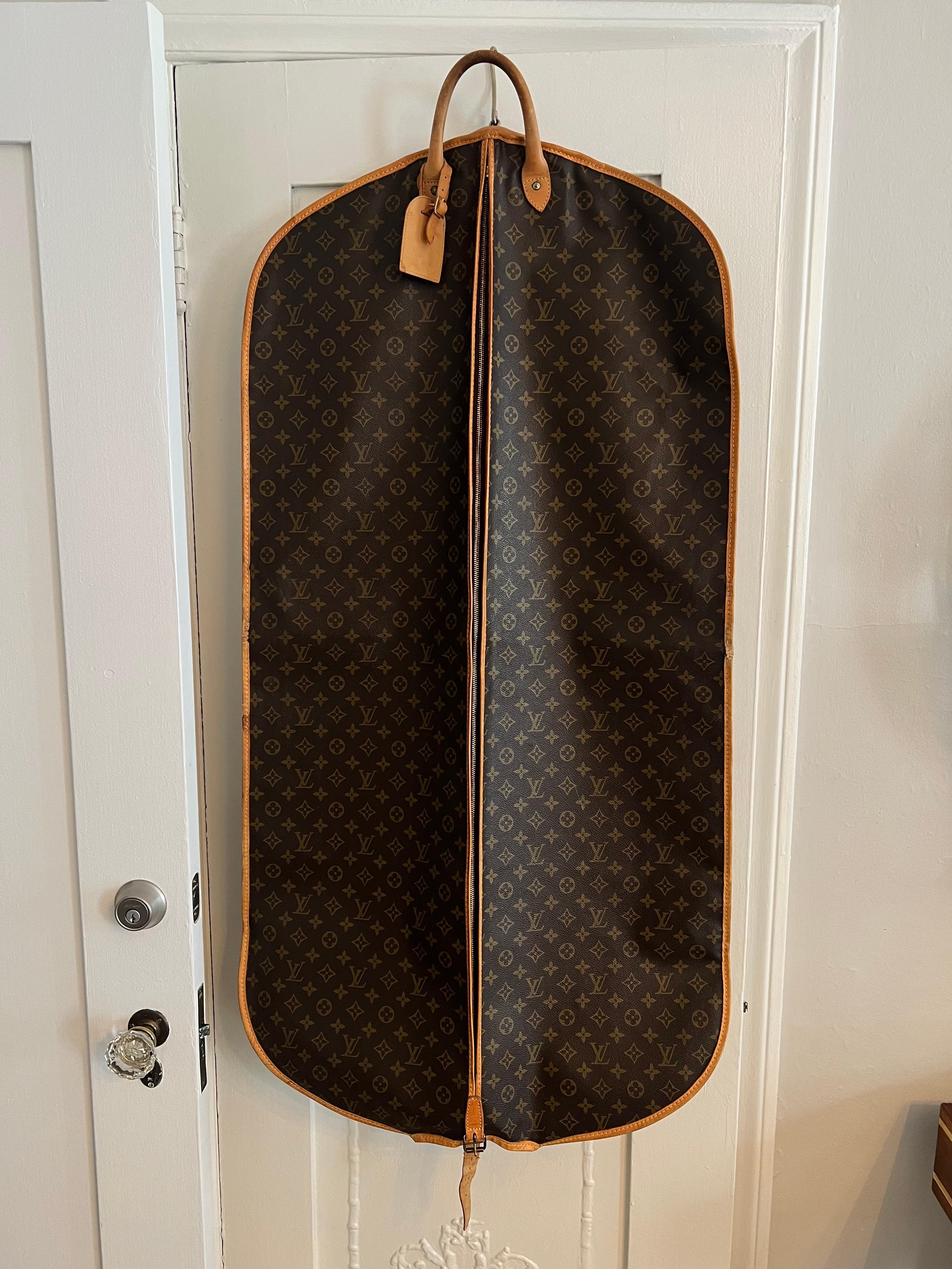 A wonderful Louis Vuitton Garment Bag - holds several shirts and suits with a convenient handle for carrying after folded.  The bag also has a hook for hanging over any door for easy access.

A leather and marked 