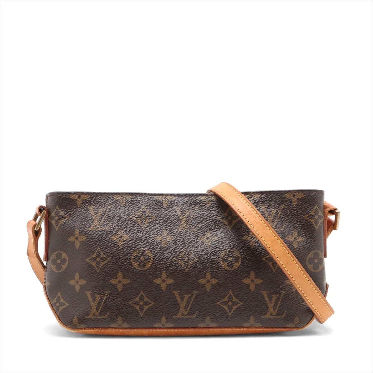 The Louis Vuitton Monogram Trotteur Shoulder Bag is a timeless and practical piece designed with everyday elegance in mind. Crafted from the iconic Monogram canvas with natural cowhide leather trim, it features a sleek rectangular silhouette that