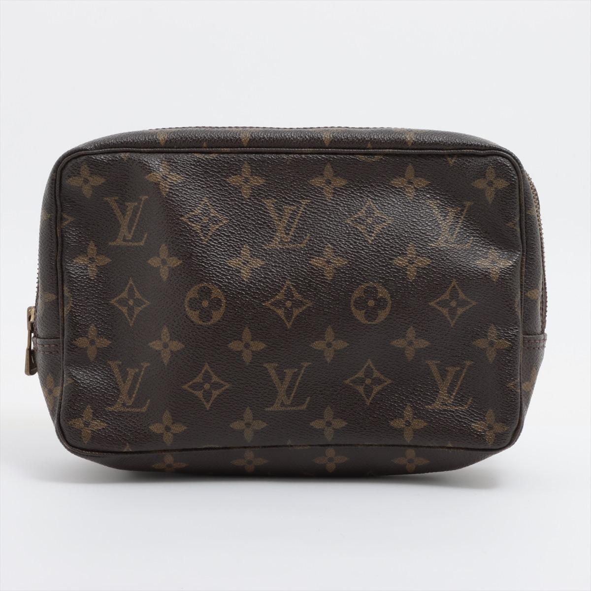 The Louis Vuitton Monogram Trousse Toilette 23 is a classic travel pouch crafted from the iconic Monogram canvas. Designed for both style and functionality, it features a spacious interior with a washable lining, making it perfect for carrying