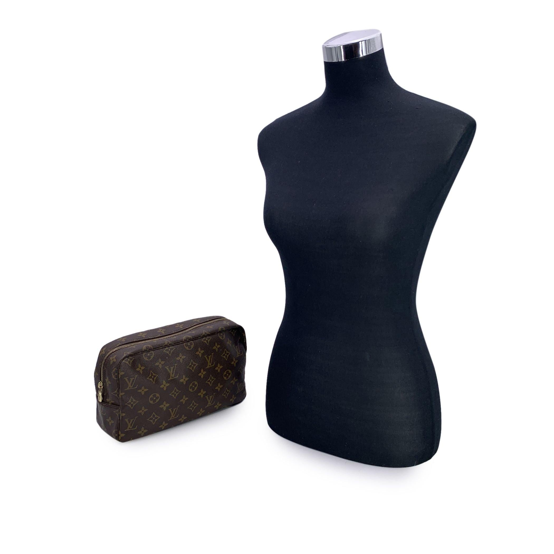 Discover the perfect blend of functionality and luxury with this LOUIS VUITTON Monogram Trousse Toiletry 28 Cosmetic Bag. A true gem for lovers of classic design, this elegant bag is crafted from Louis Vuitton's signature brown monogram coated