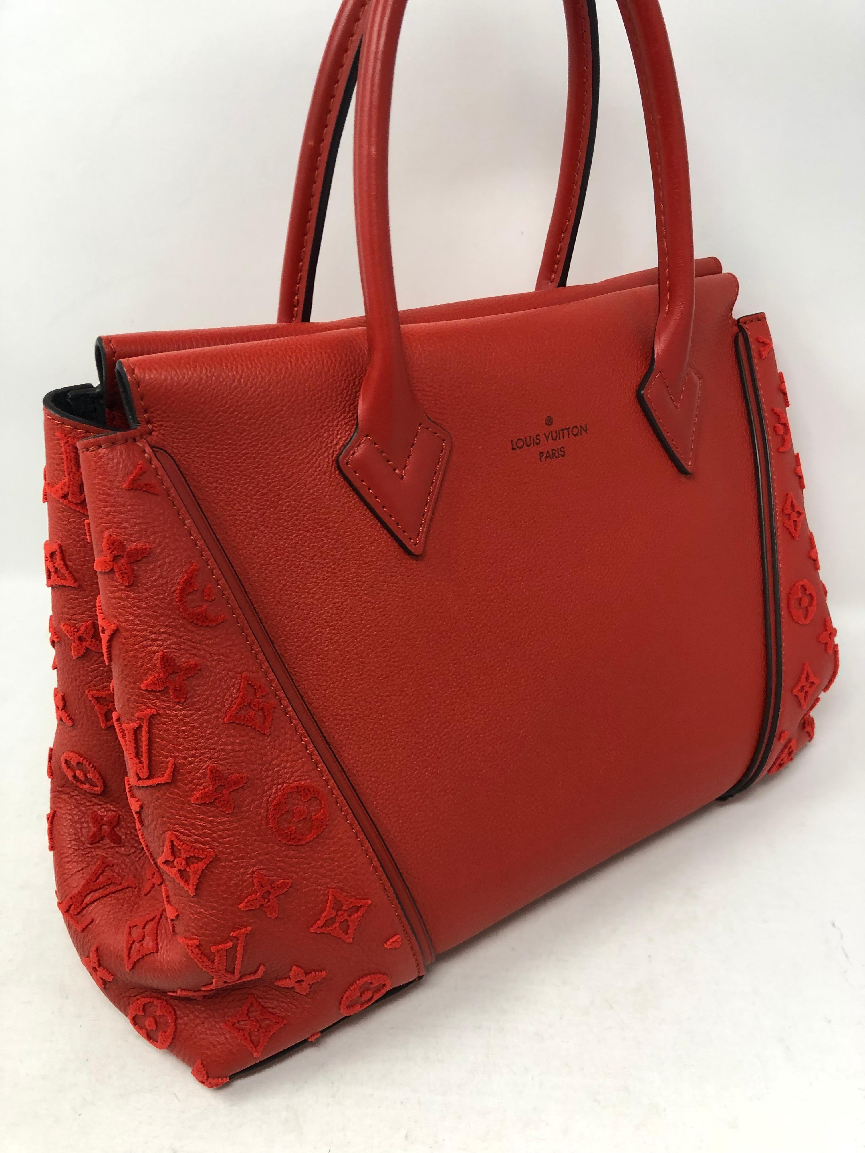 Louis Vuitton Monogram Velours W PM bag in Red Veau Cachemire leather. Tufted Velour monogram pattern on sides. Luxurious Charcoal Alcantara lining. Dual rolled top handles. Mint condition. Never used. Guaranteed authentic. 