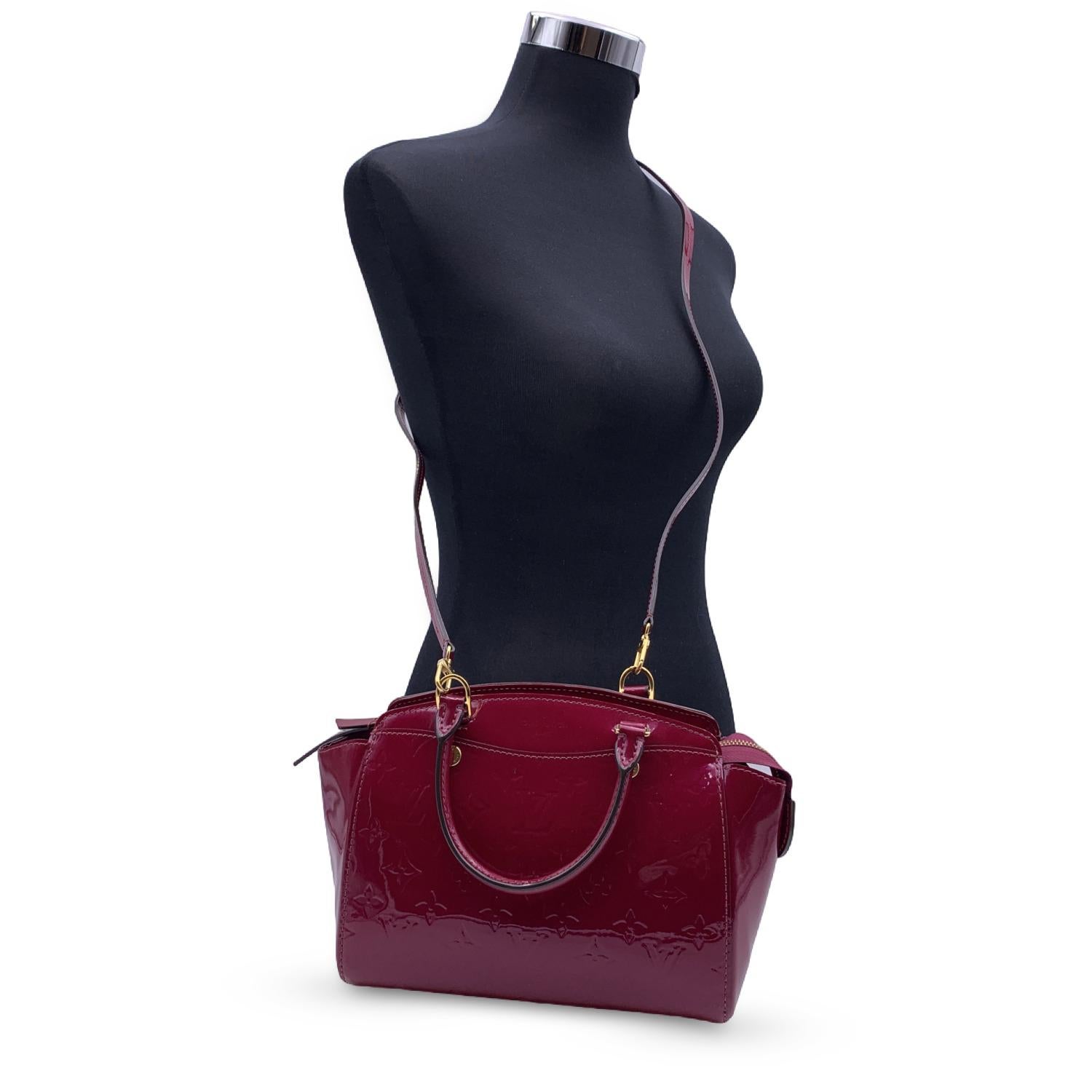 This beautiful Bag will come with a Certificate of Authenticity provided by Entrupy. The certificate will be provided at no further cost.

Louis Vuitton 'Brea PM' bag in red magenta monogram vernis leather. Double top handles and removable shoulder