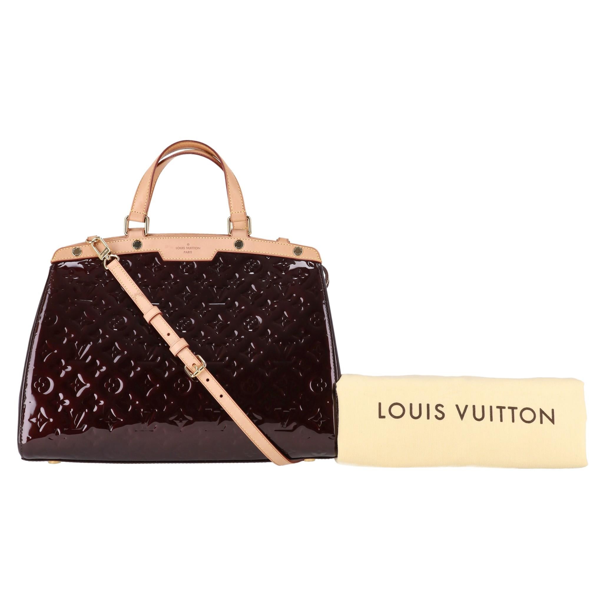Louis Vuitton Monogram Vernis Patent Leather Brea Bag

Deep maroon tote bag crafted from LV signature monogram embossed shiny Vernis patent leather.

Featuring beige trim, dual top handle and detachable, adjustable shoulder strap.

Gold 'Louis