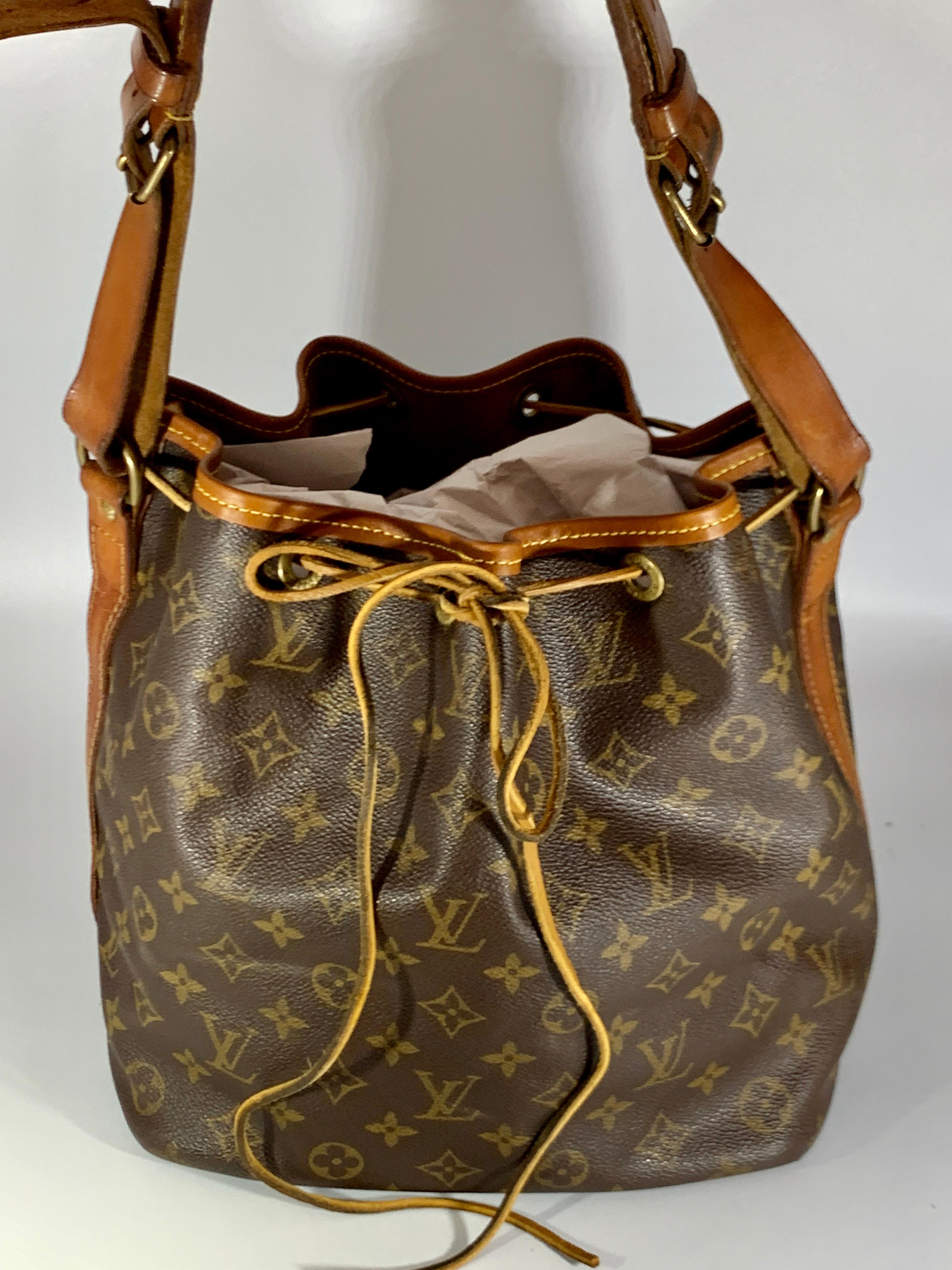 LOUIS VUITTON
French Company Vintage 
Description
Brown and tan monogram coated canvas
 vintage Louis Vuitton French Company
 Very old vintage item, thus not meant for fussies. 
Purchased in Japan 2 years ago at one of the vintage stores.
Adjustable