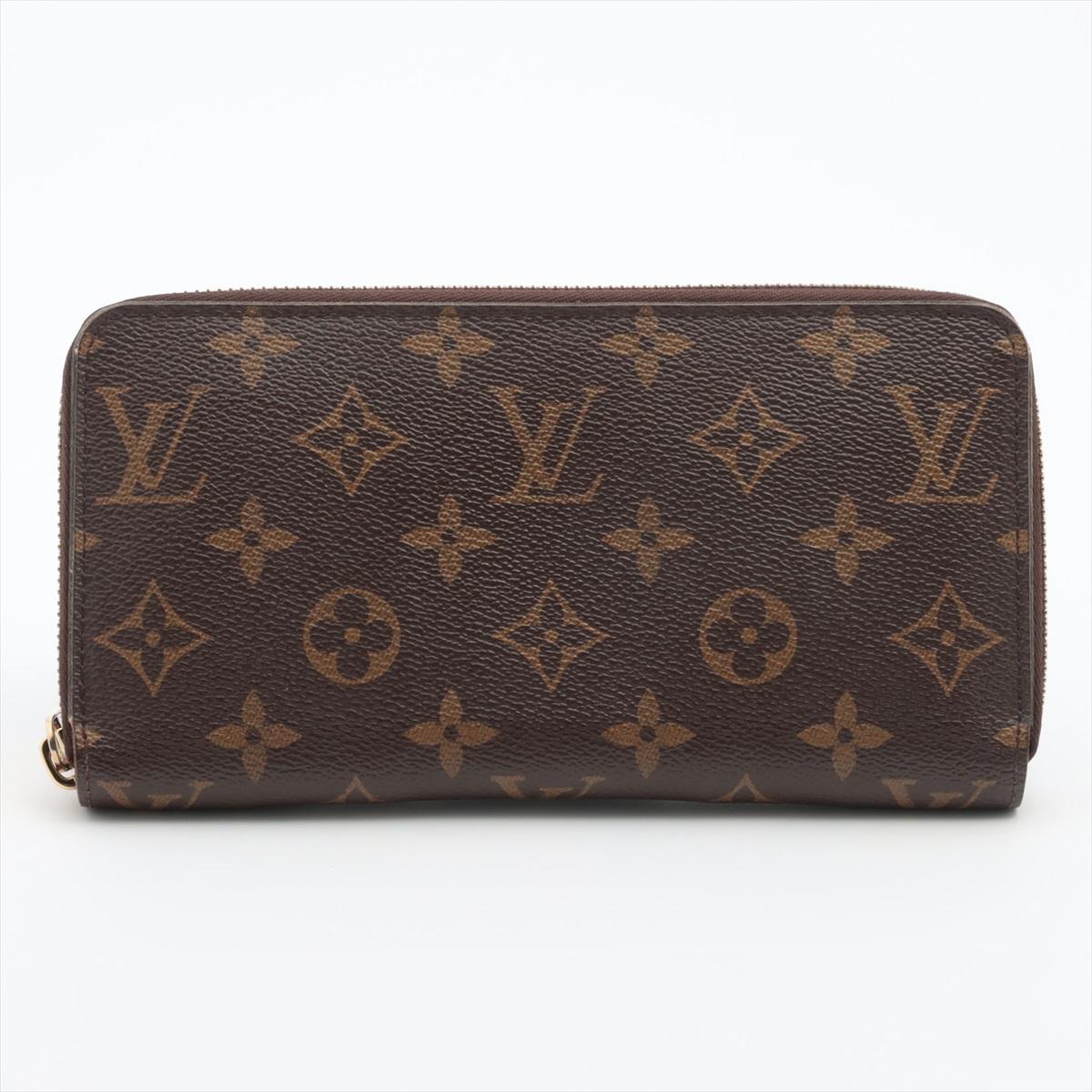The Louis Vuitton Monogram Zippy Wallet is a timeless and sophisticated accessory that combines style with practicality. The wallet showcases the iconic Louis Vuitton Monogram canvas, featuring the classic LV initials and floral motif pattern. The