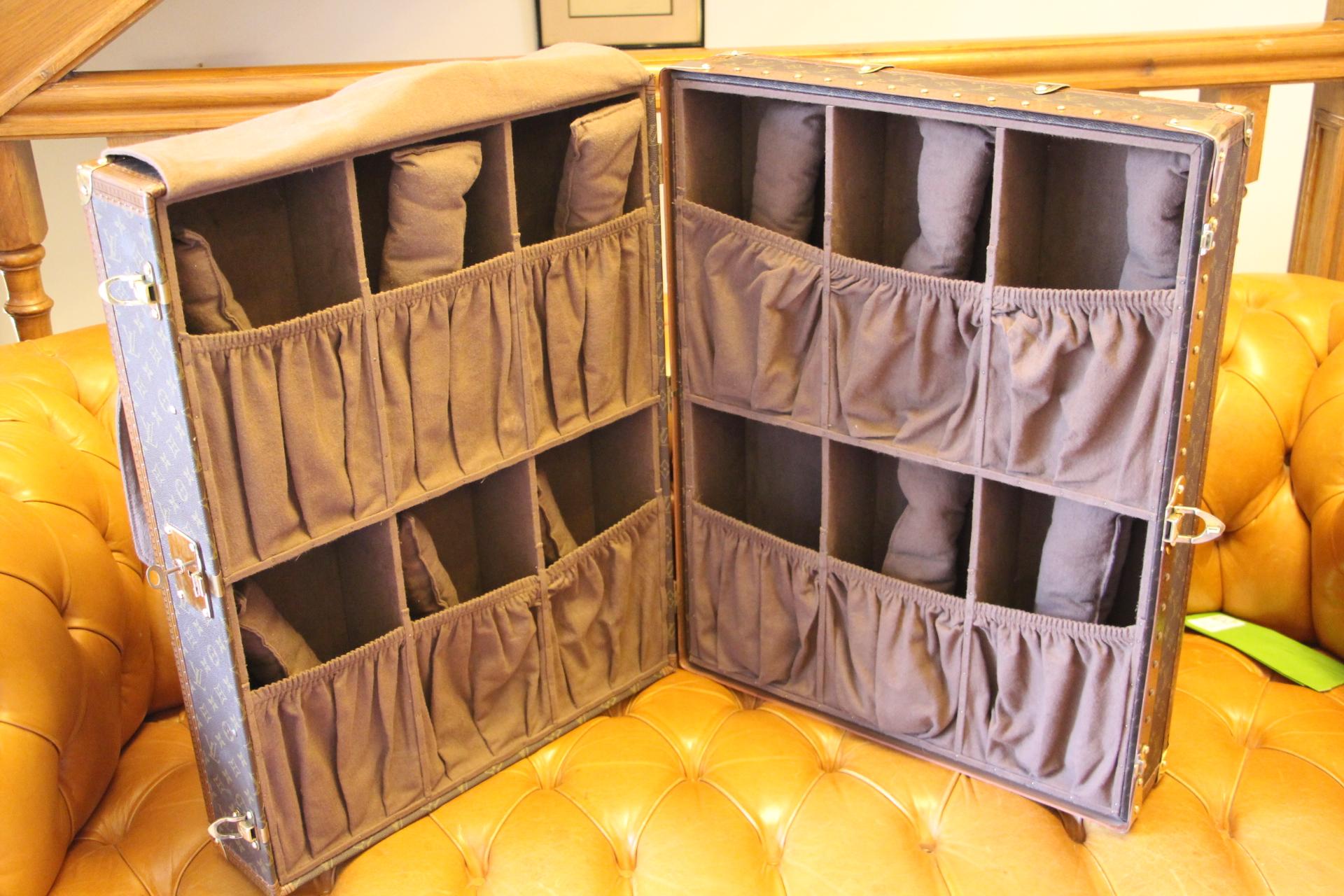 This trunk was a special order made in 1980s. It features monogram canvas, stamped LV solid brass locks, corners and studs. On the top is the leather handle, Louis Vuitton embossed.
Inside is all brown suedine featuring 12 compartments, each one